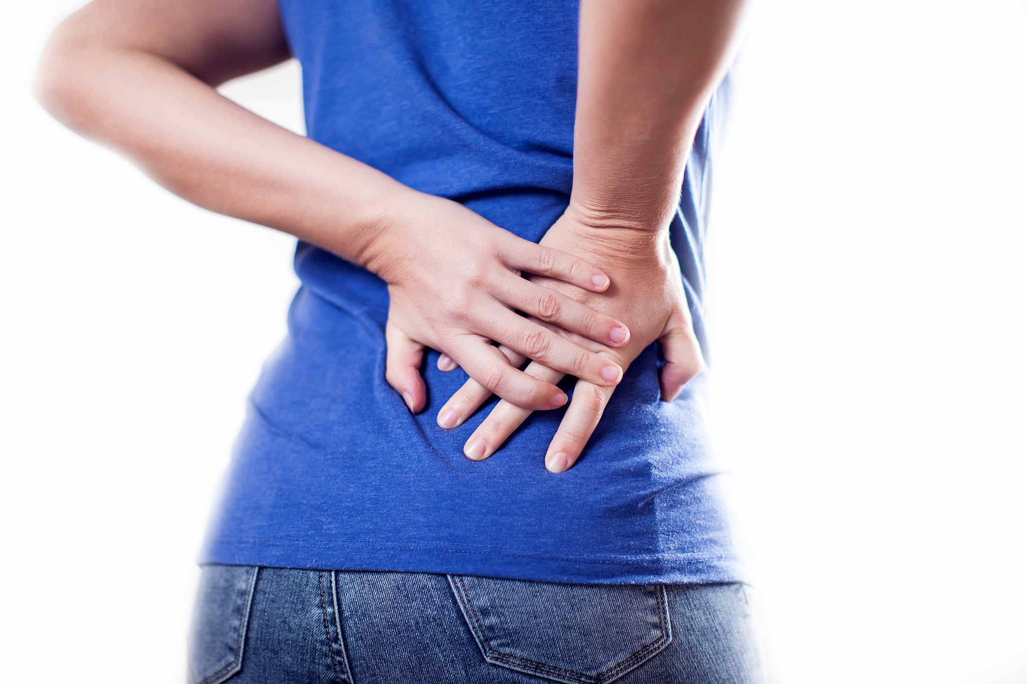 woman feels backache isolated. people, healthcare and medicine c