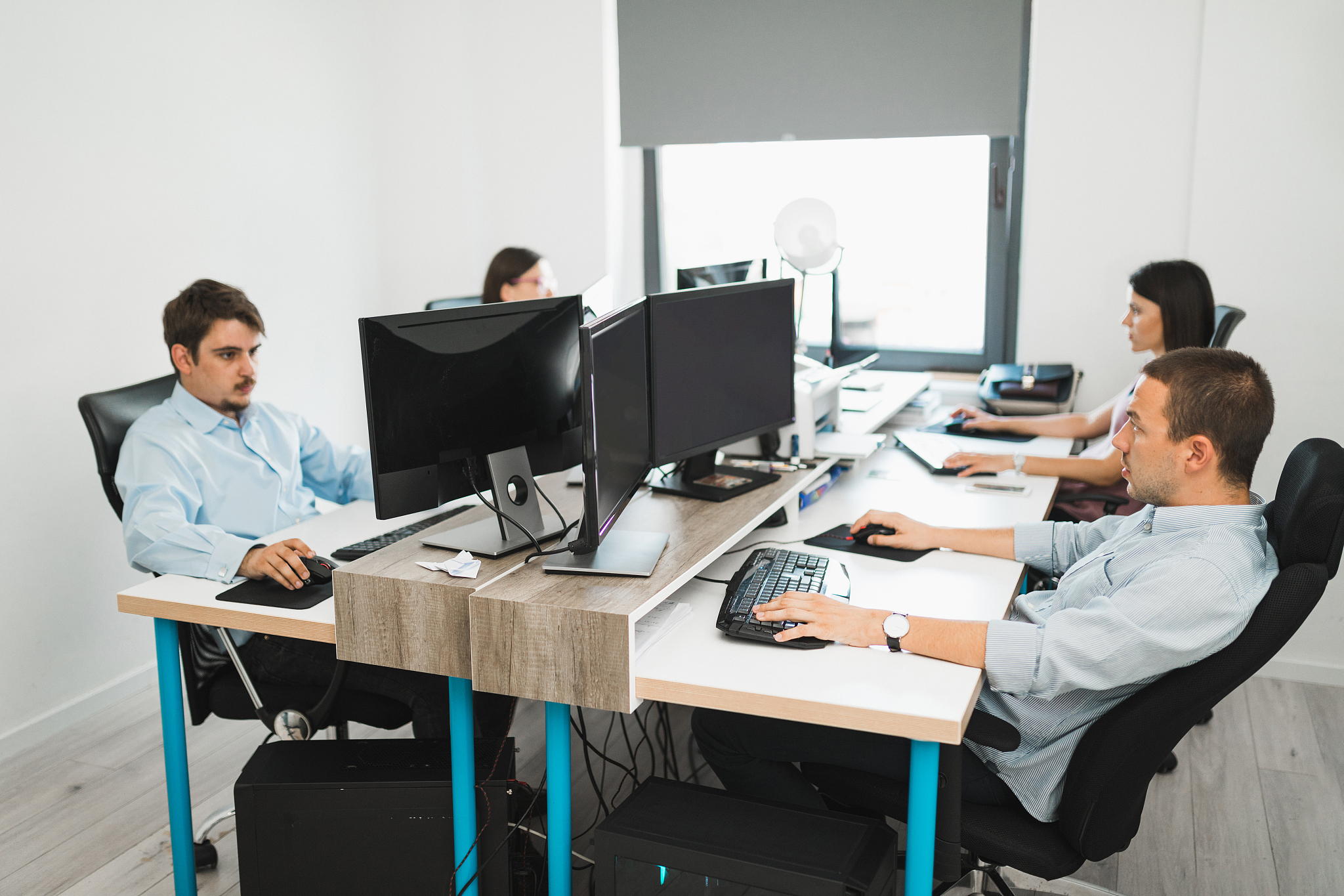 team of young millennial people working in the office and using 