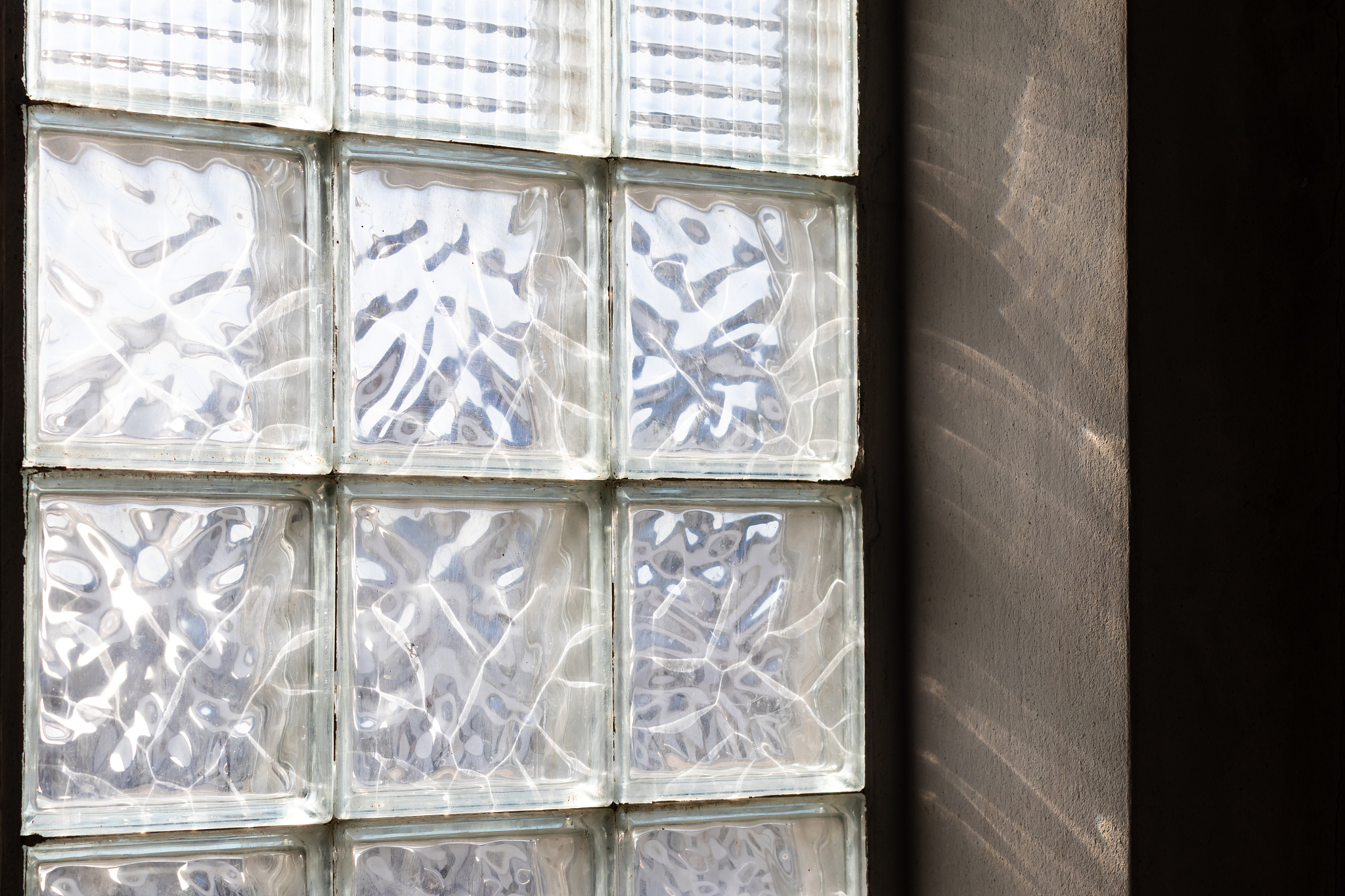 walls of glass, many old brick blocks with sunlight.