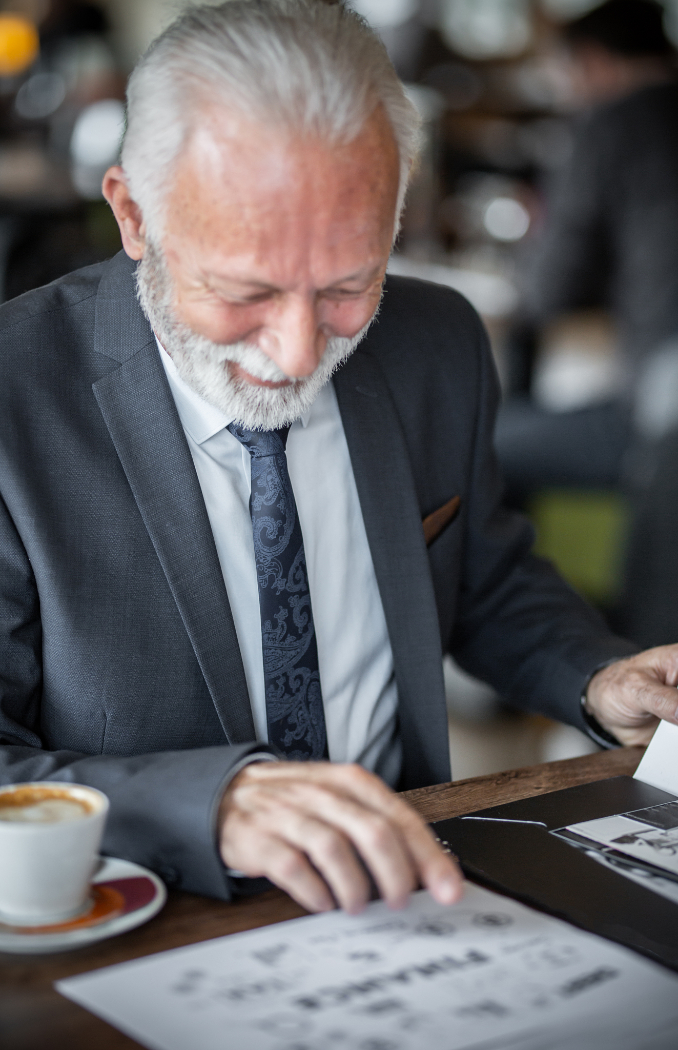 old businessman looking at project stock photo