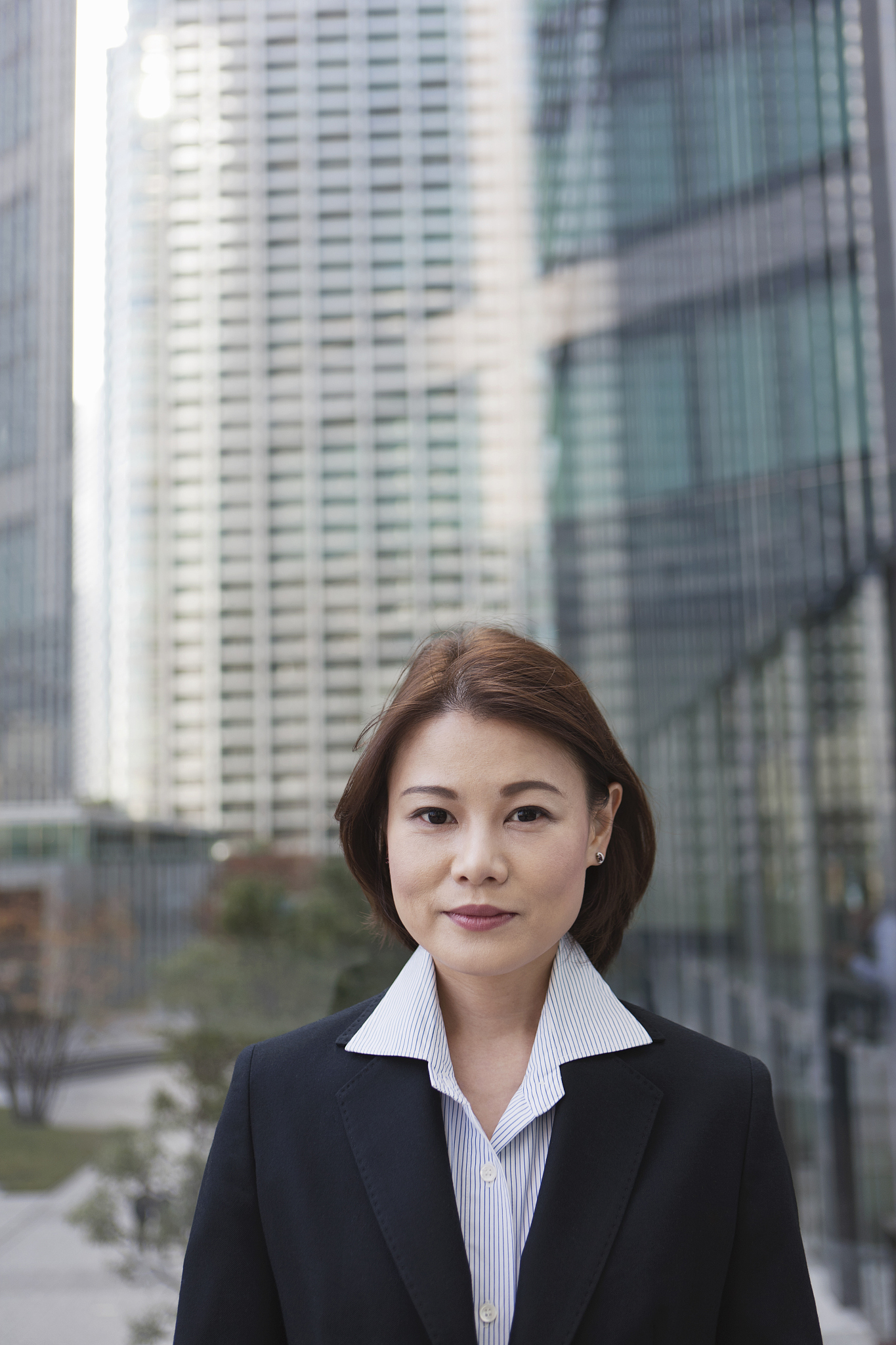 business woman in city with modern buildings