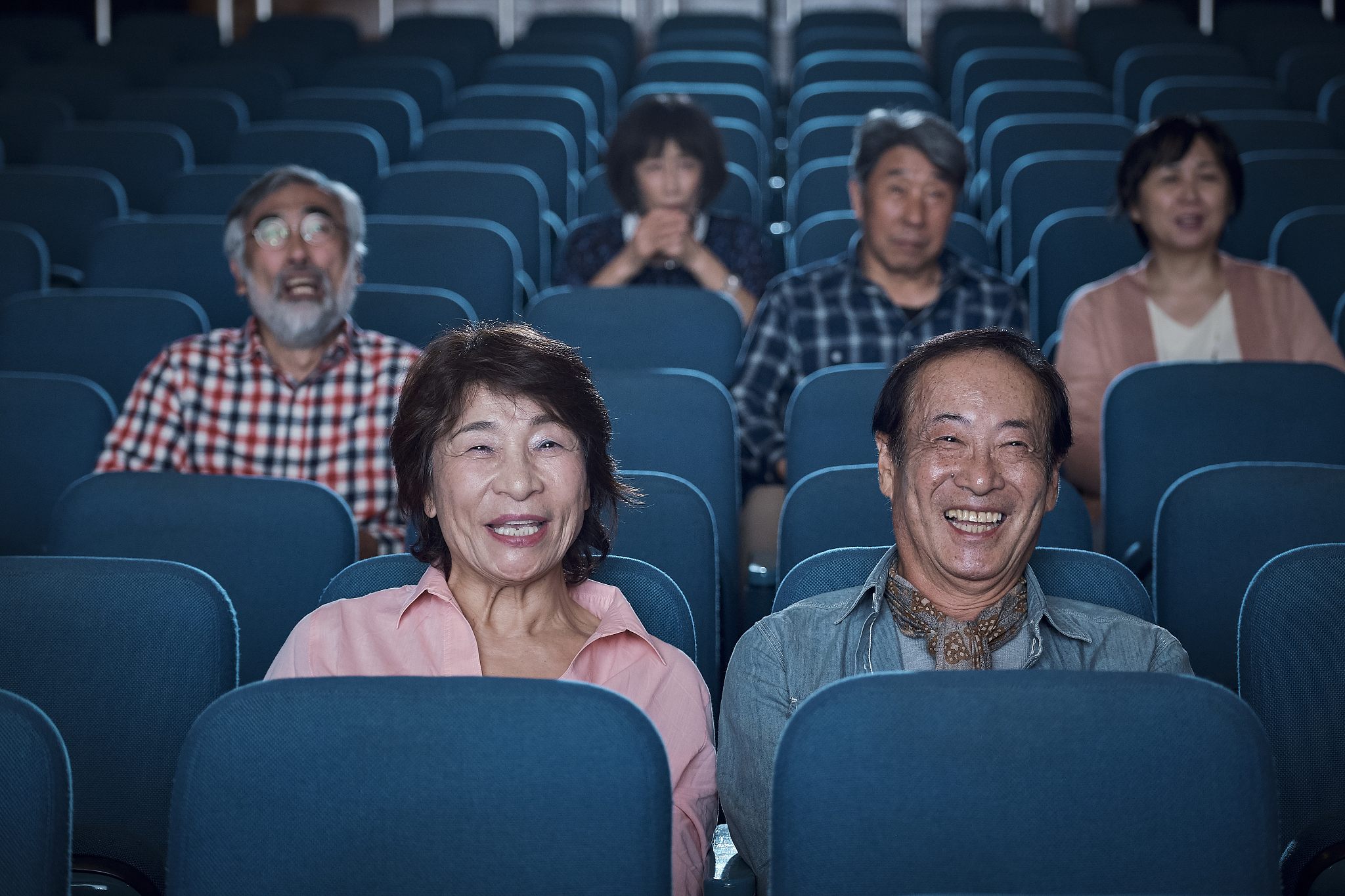 spectators watching a movie in a cinema