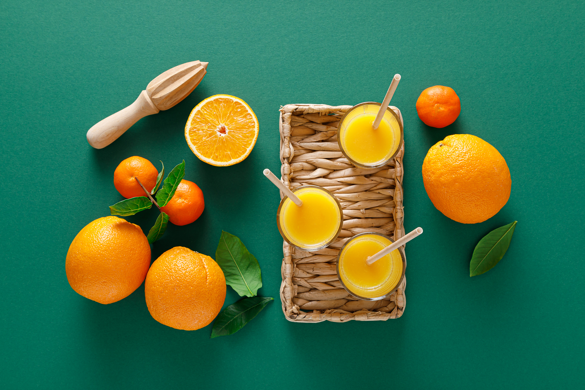 freshly squeezed orange juice in a glass pitcher and fresh fruit
