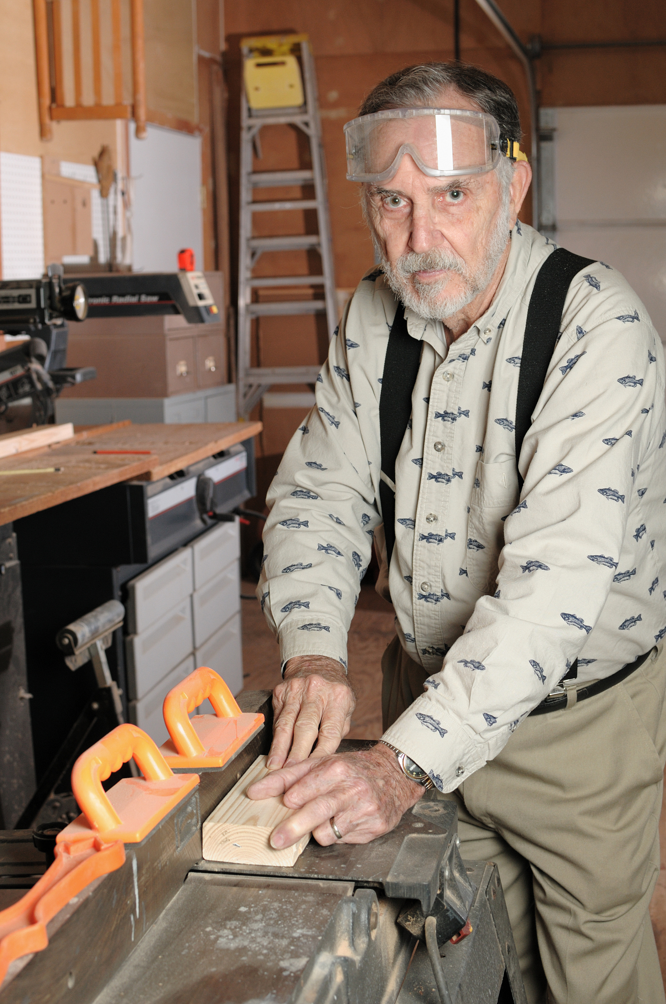woodworker using joiner in careless manner