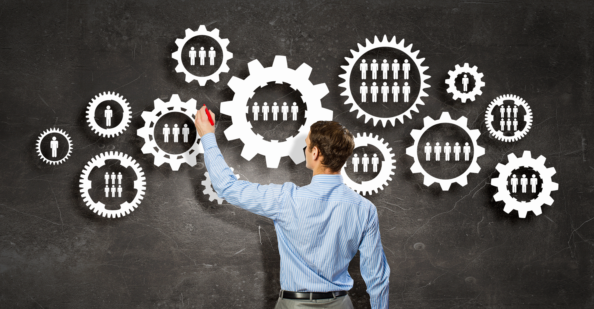 man presenting teamwork concept. businessman standing with back 