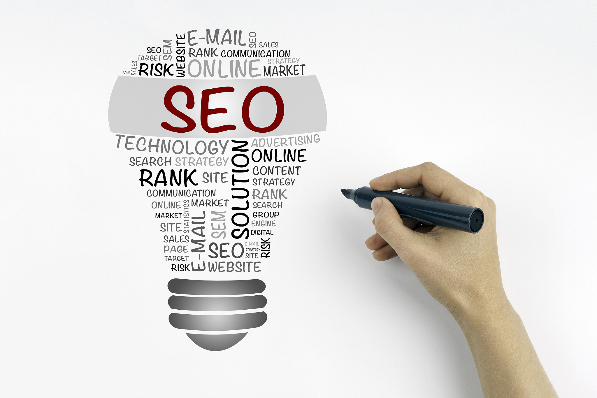 hand with marker writing: seo