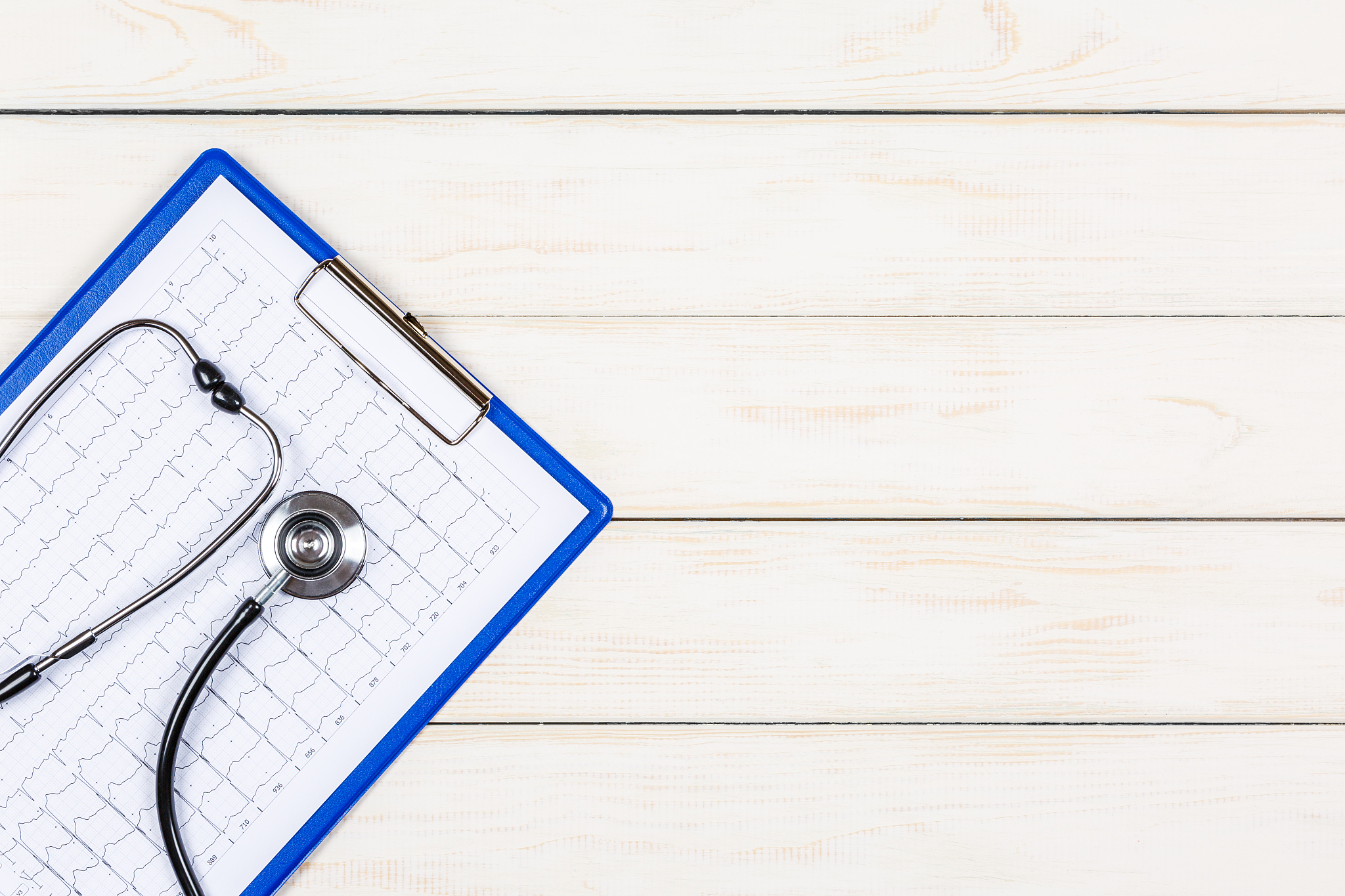 medical concept on a white wooden background.