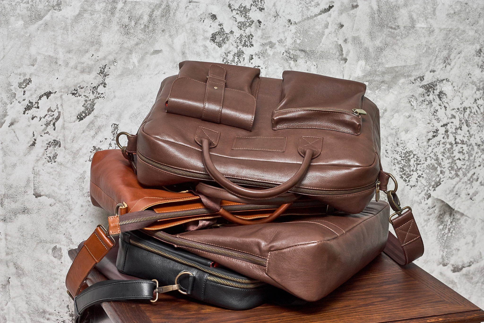 leather business bag and accessories in the work room with gray 