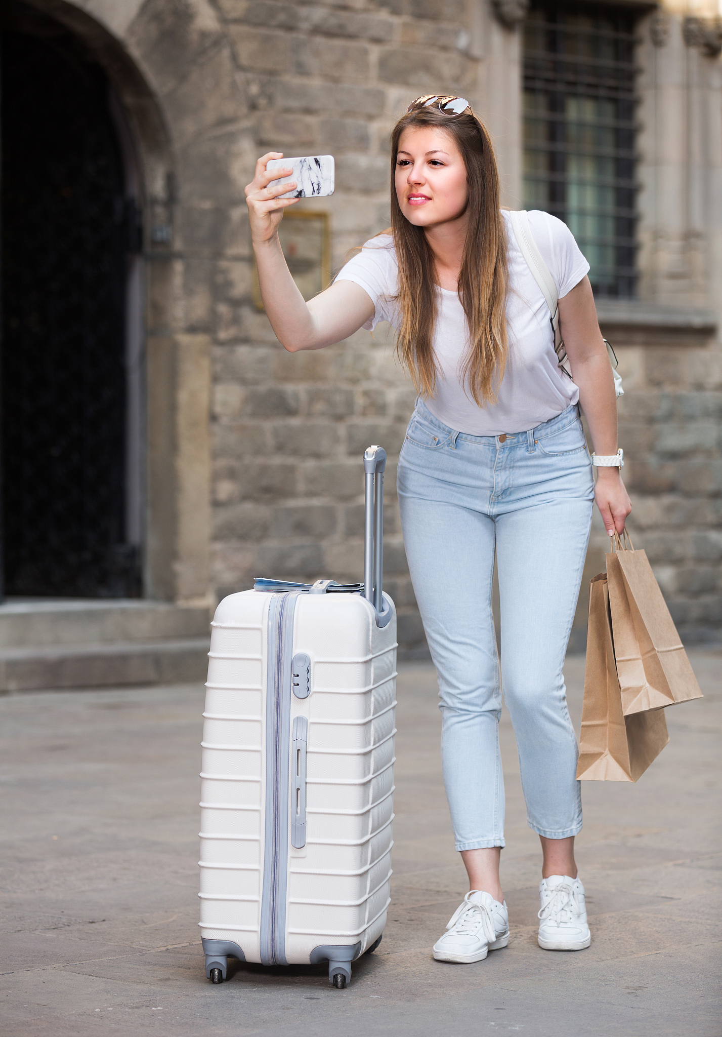 woman is taking photo on her phone