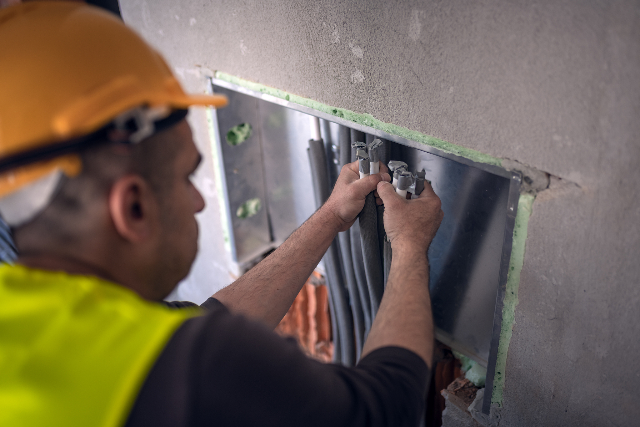 maintenance engineer is working inside the building site