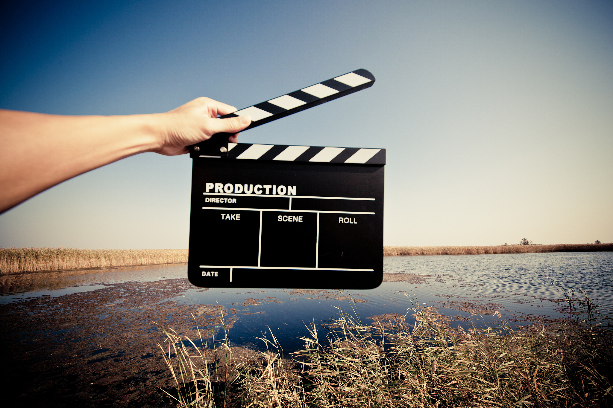 hands holding a movie clapboard