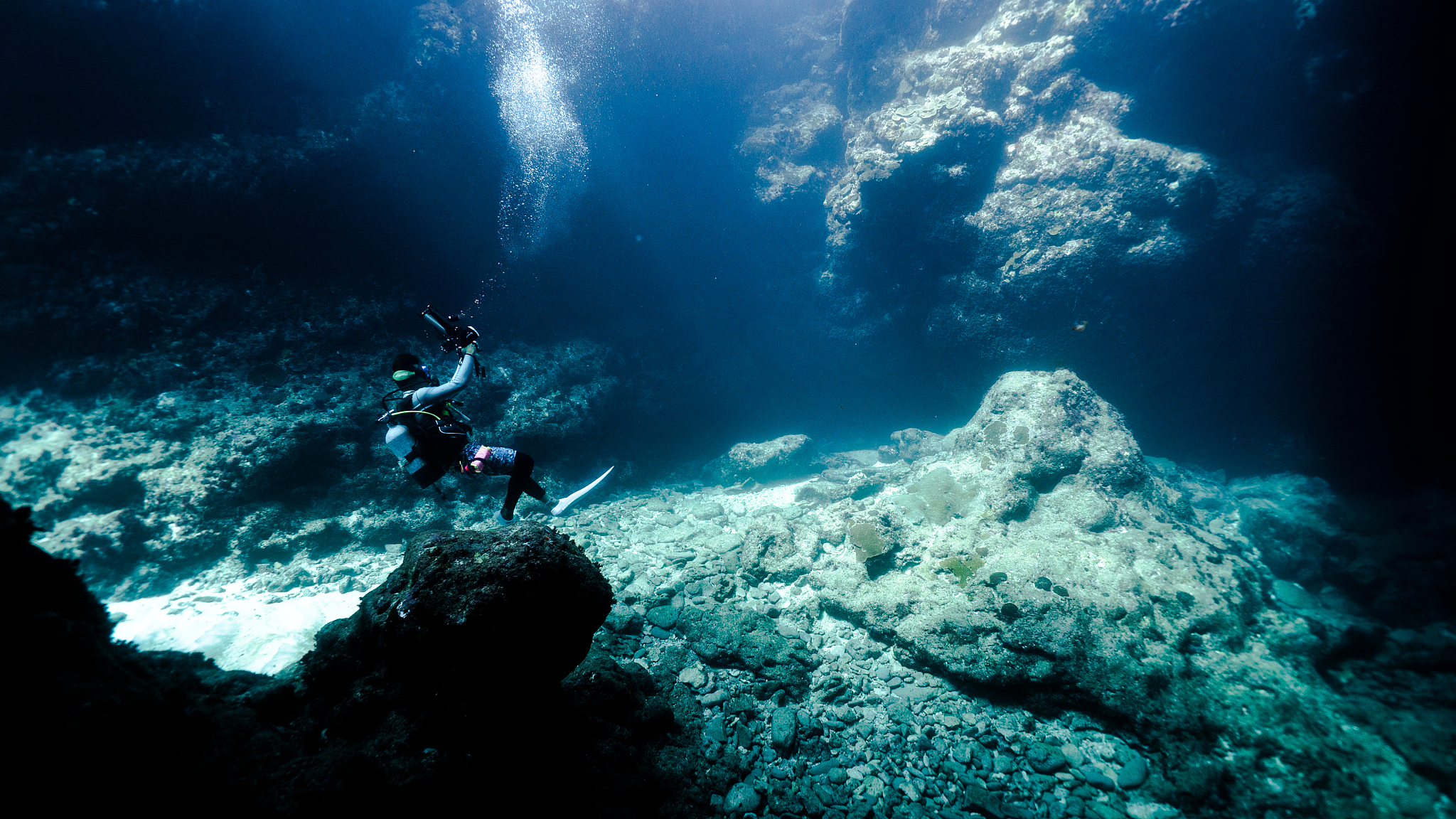 man swimming undersea