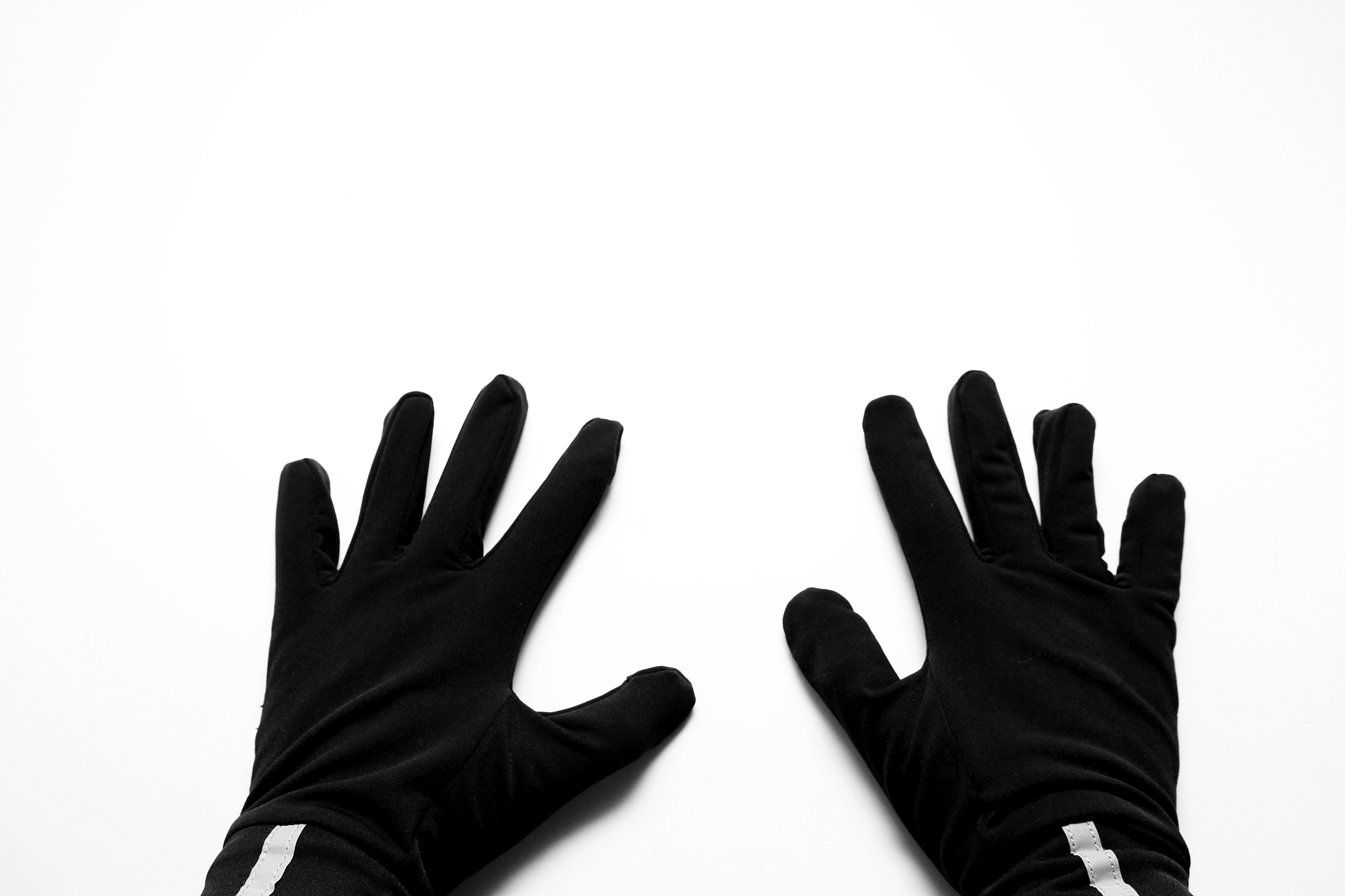 close-up of hand with gloves against white background