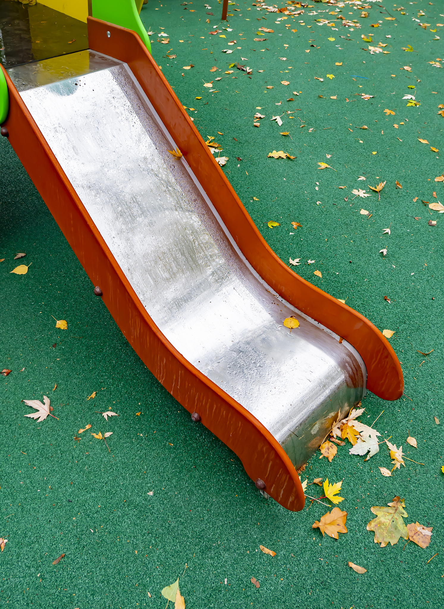 children's playground with a swing in the autumn park.