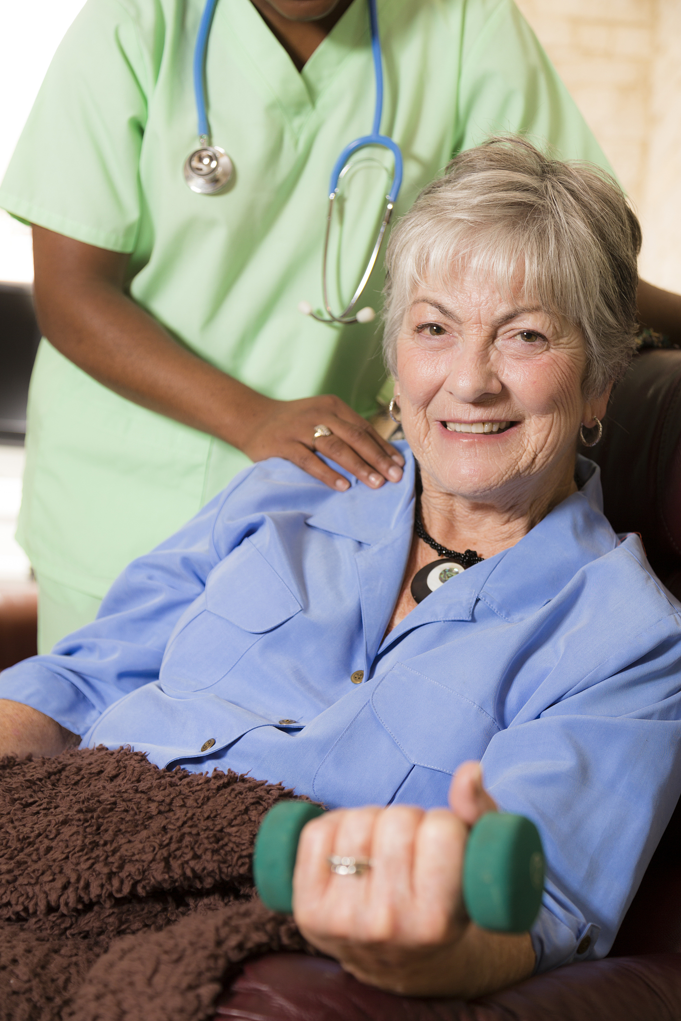 senior adult patient with home healthcare nurse. physical therap