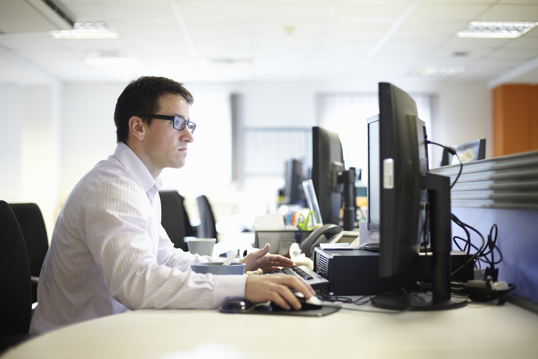 man using computer in office