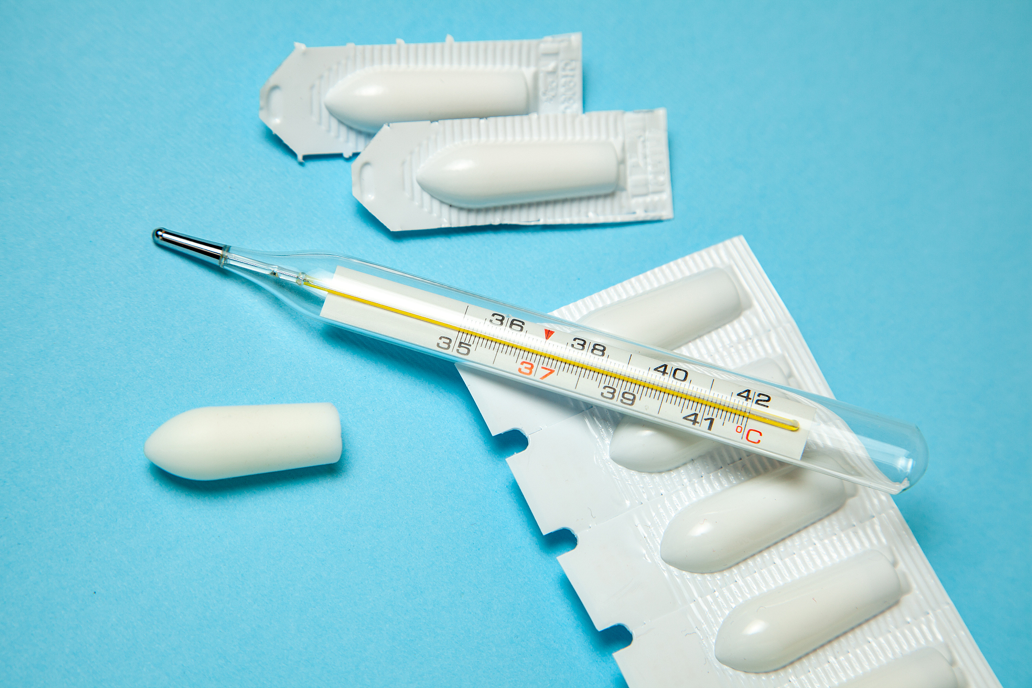 suppository for anal or vaginal use and thermometer. candles for