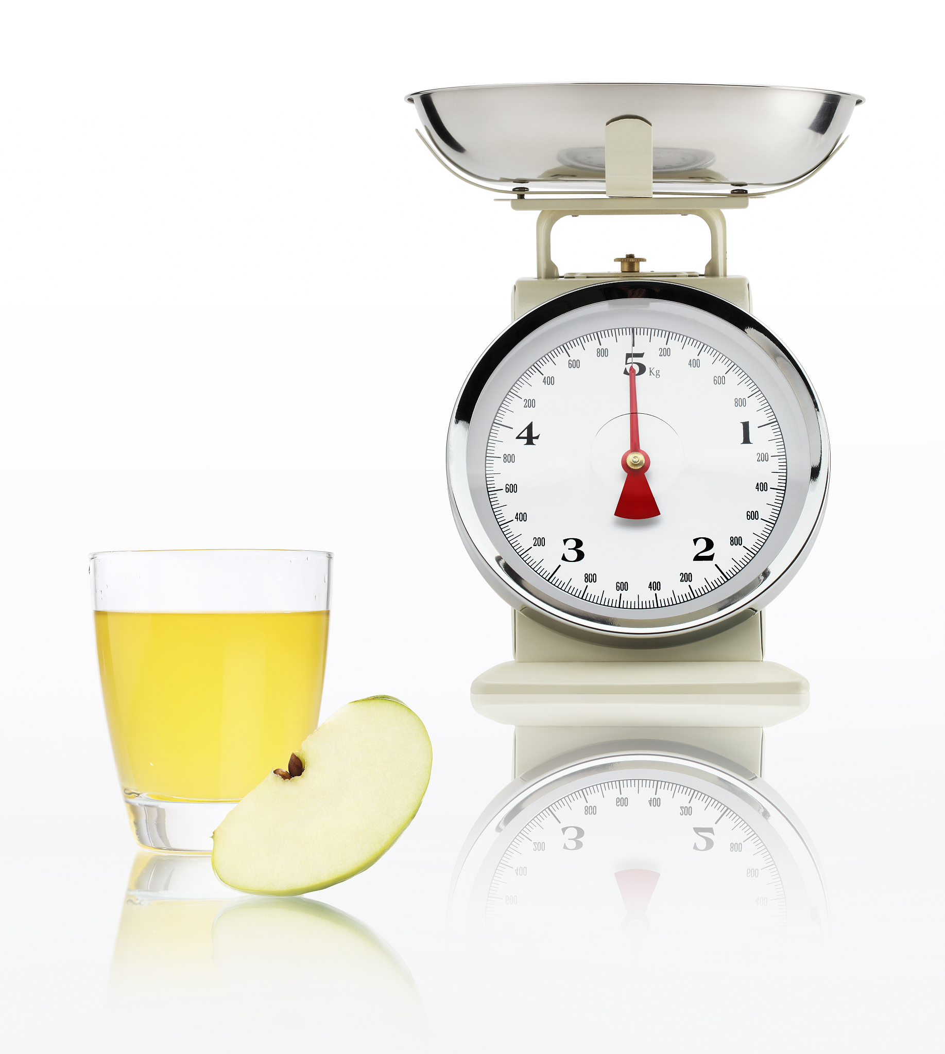 food scale with apple juice glass isolated on white background, 