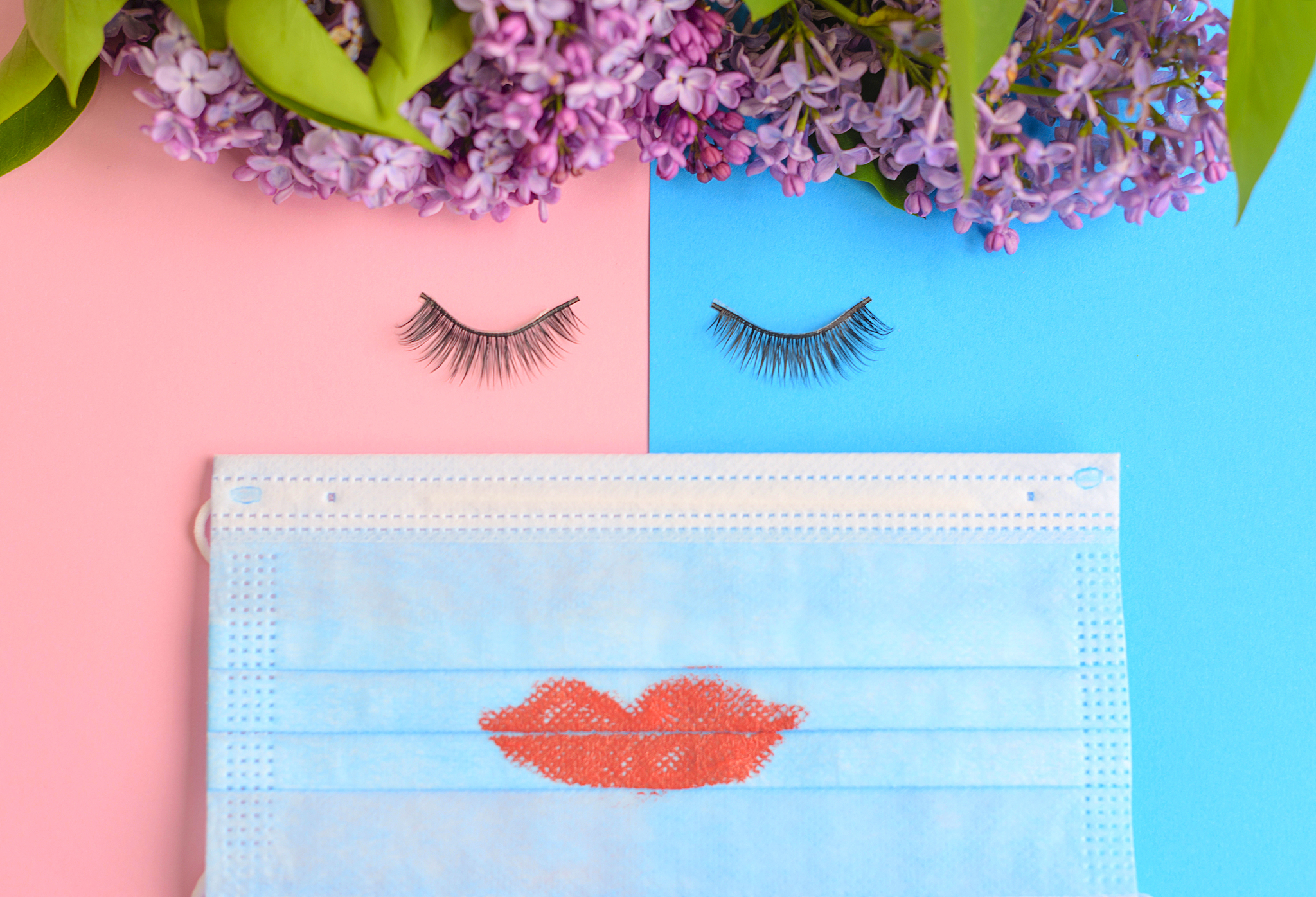 a face made from false eyelashes, a protective face mask and lil