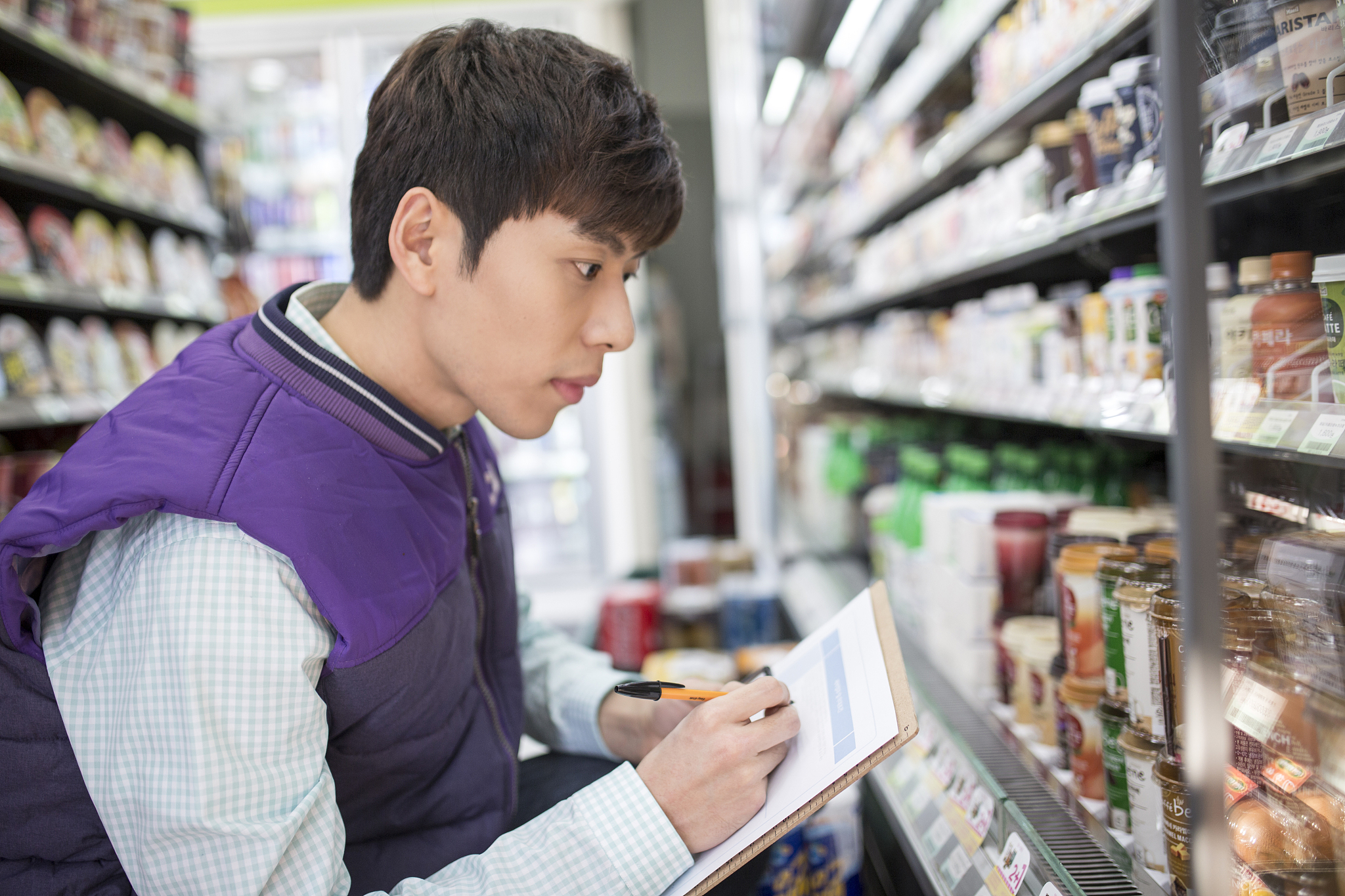 man working at convenience store