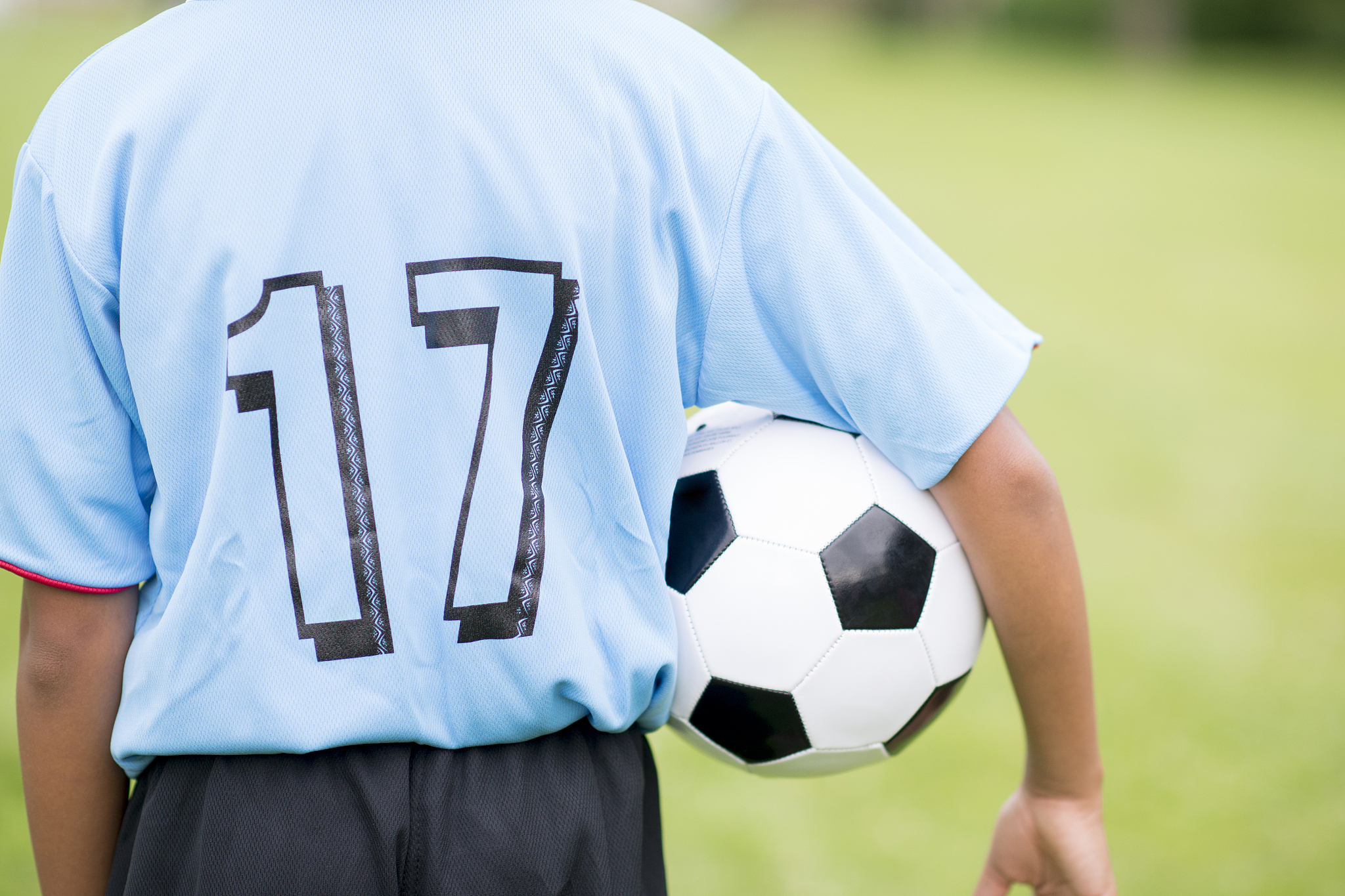 holding soccer ball