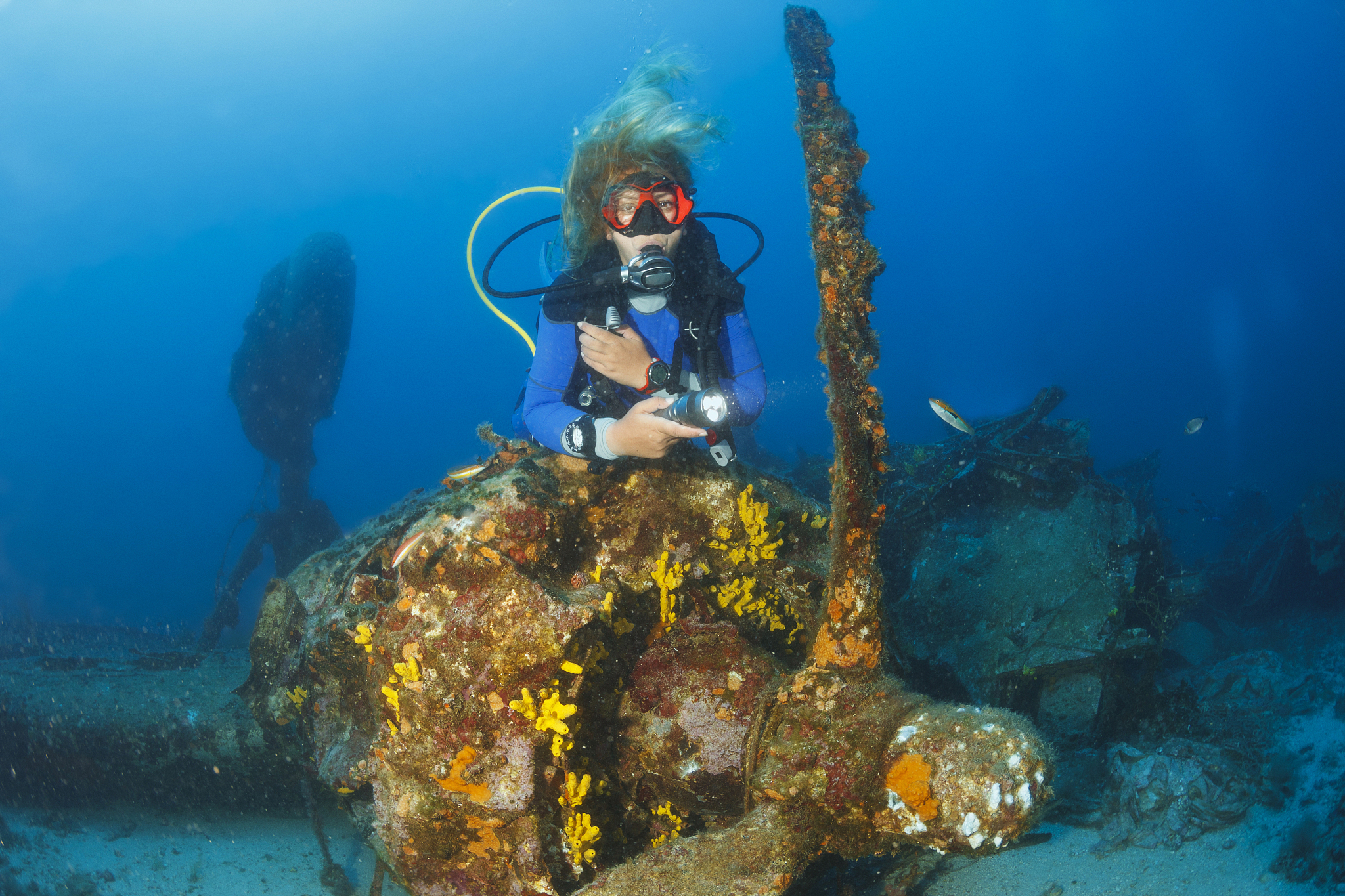 scuba diving exploring and enjoying wreck diving over a b-24 lib