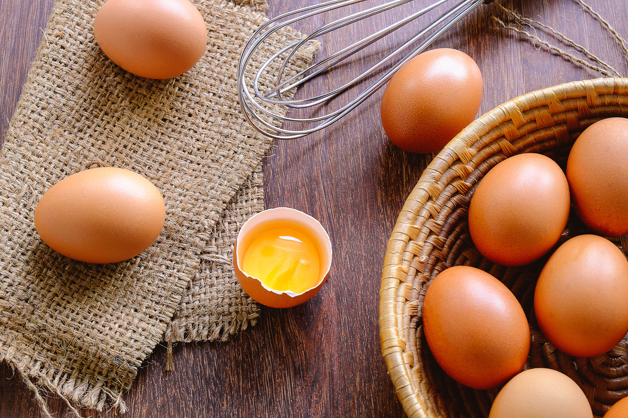 fresh organic chicken eggs in a basket.