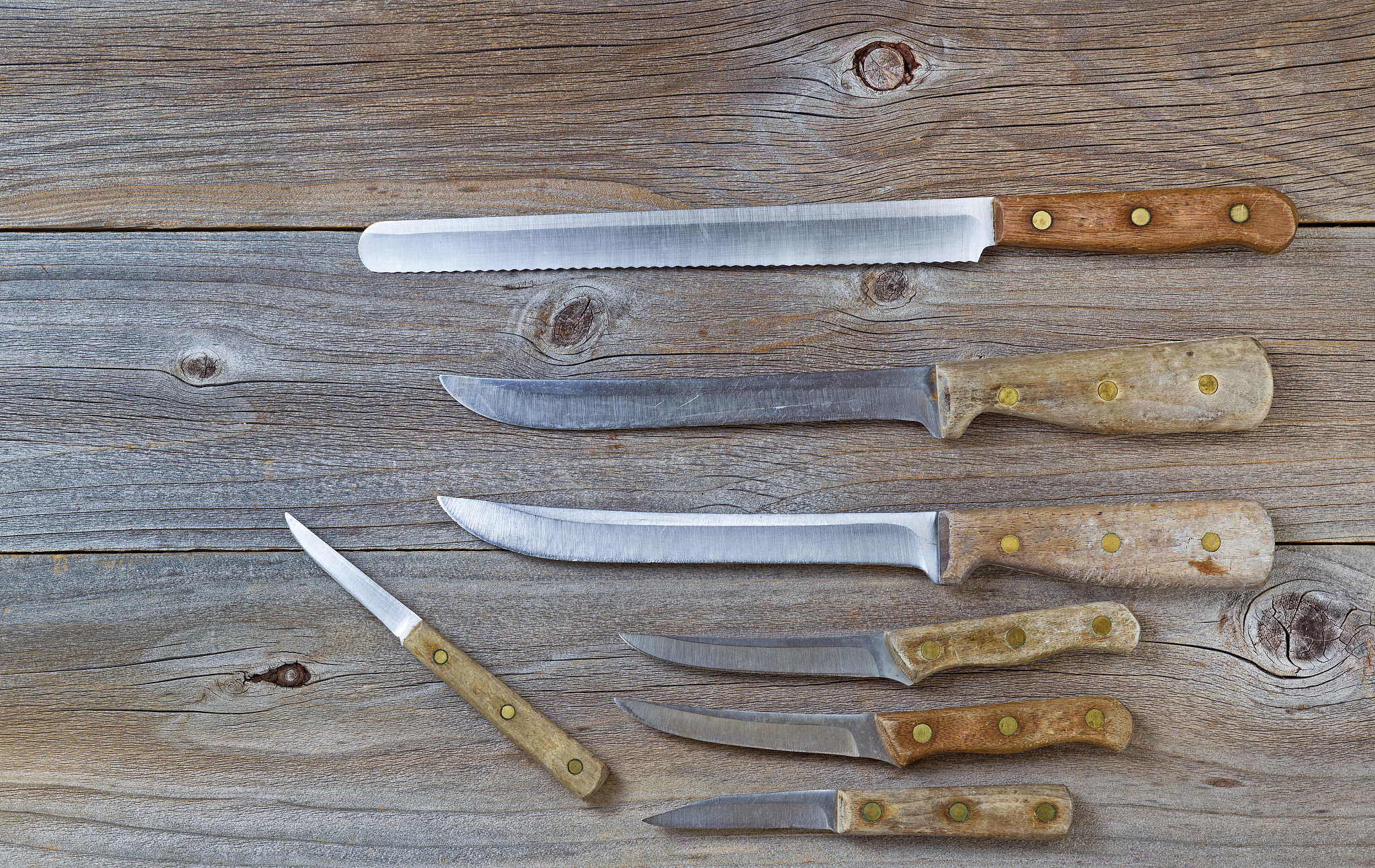 vintage knives on rustic wood