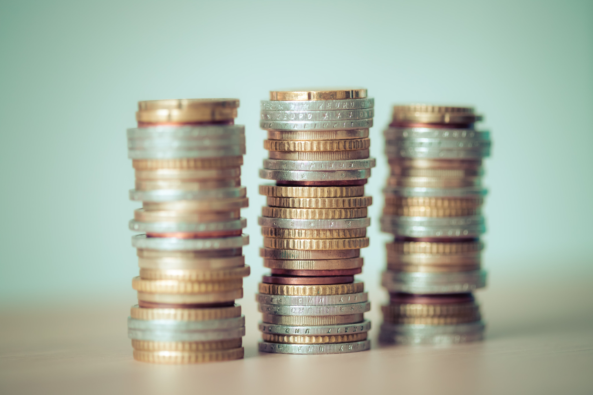 market crisis and financial aid concept: coins tacked on each ot
