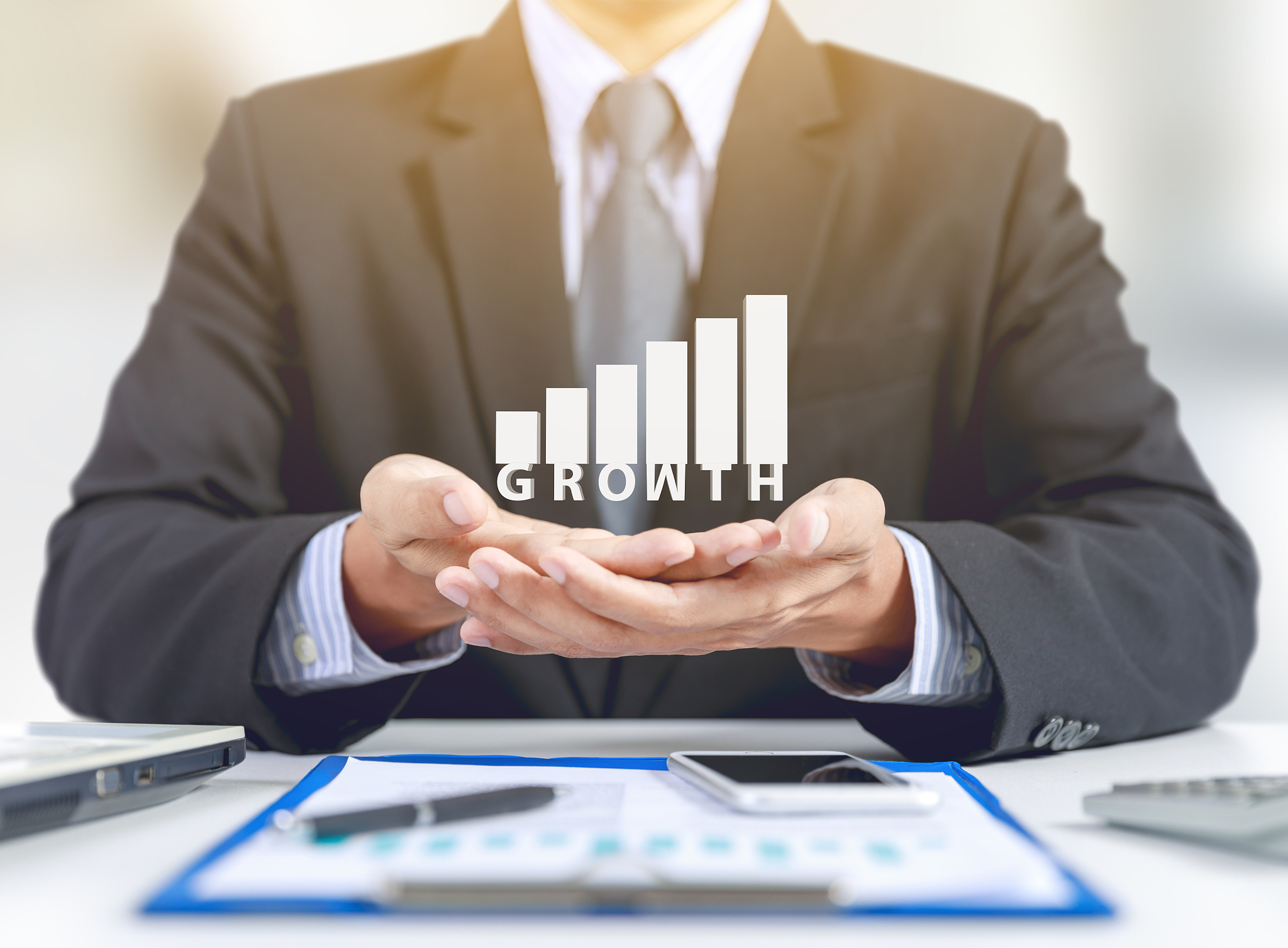 businessman present graph with growth