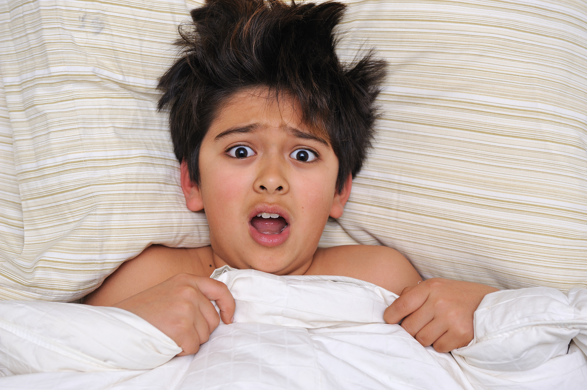 scared boy in bed