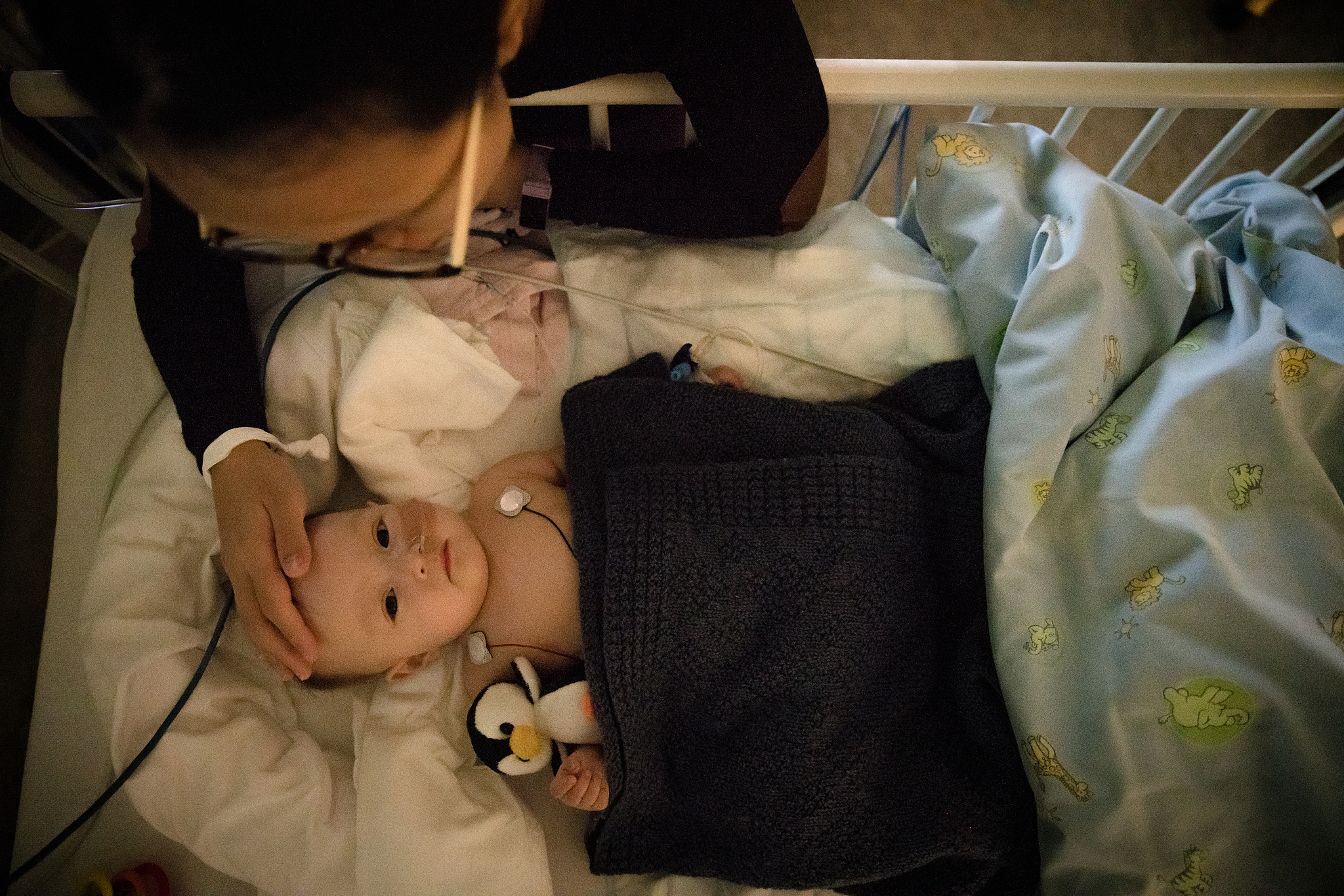 worried mom watching over her sick baby