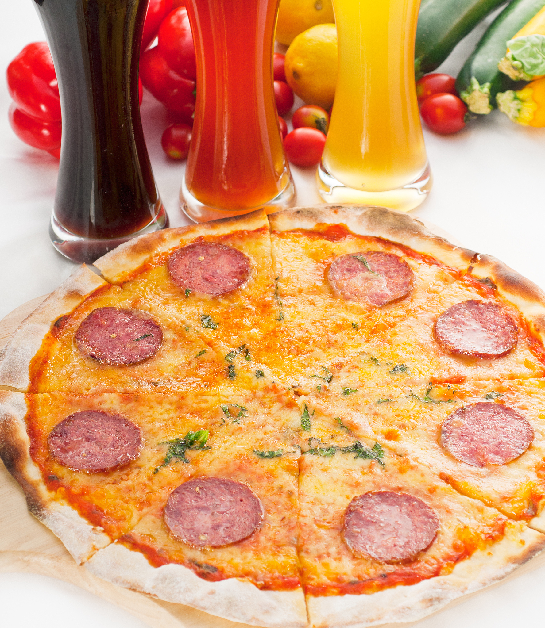 close-up of pizza and drinks