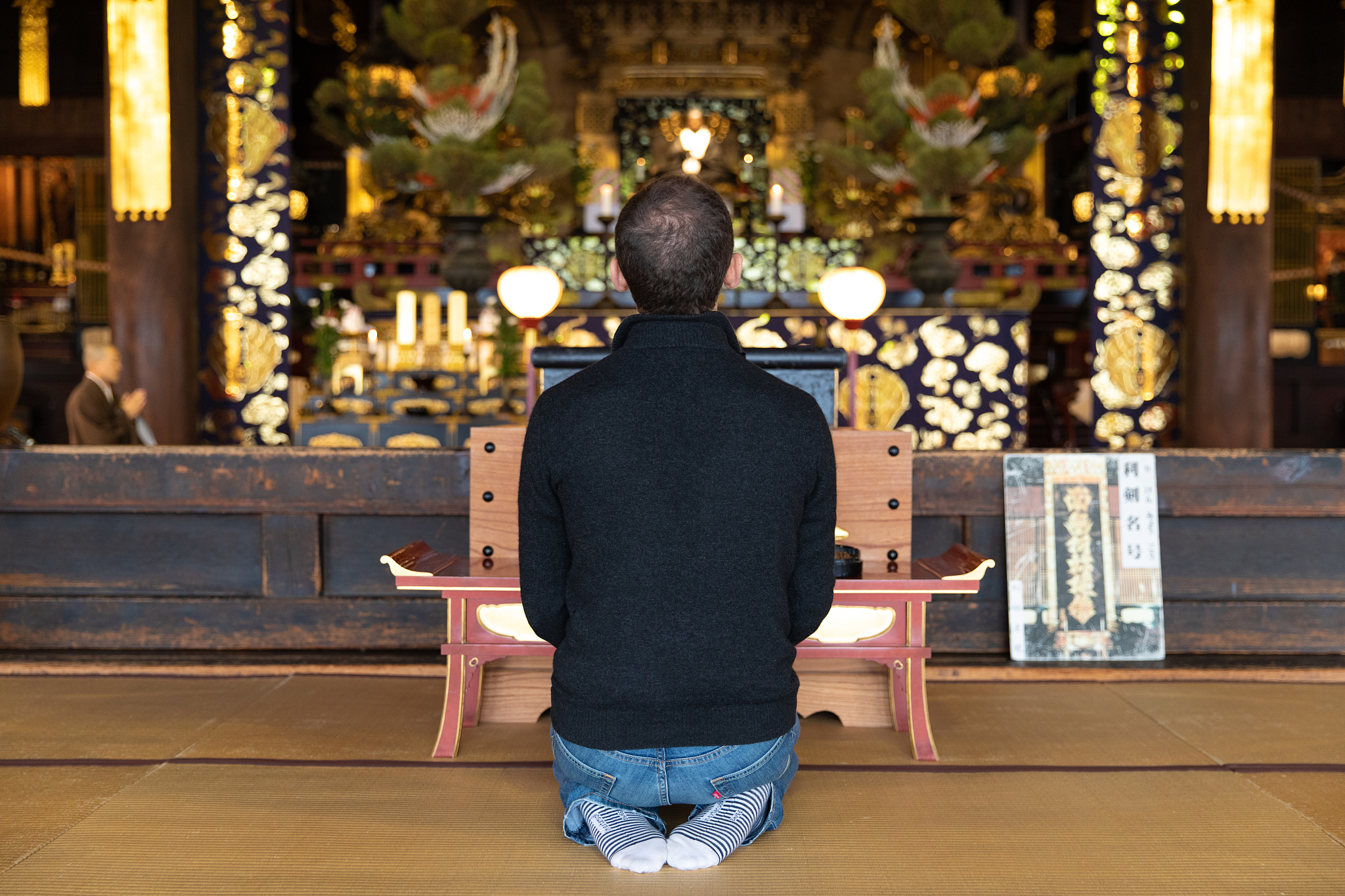 caucasian man meditating in temple