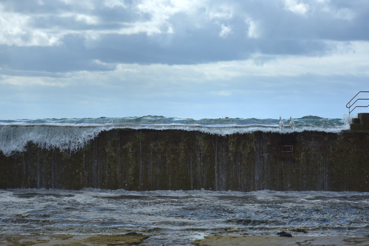 Heavy Rainfall Turns Sea Yellow Due to Iron Ore Runoff