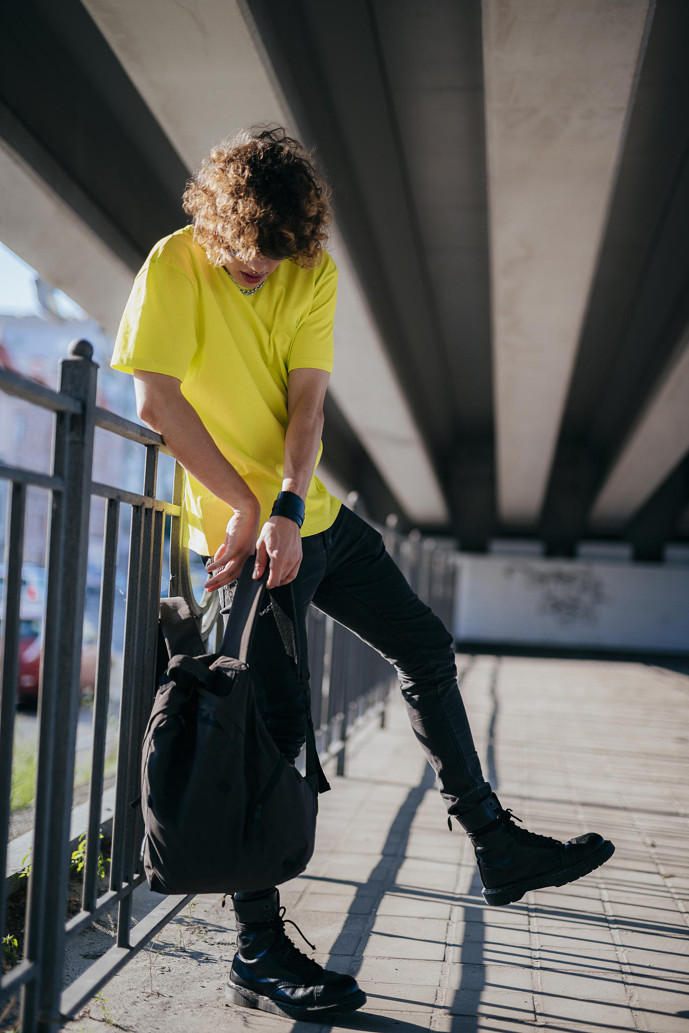 young hipster with backpack outdoors stock photo