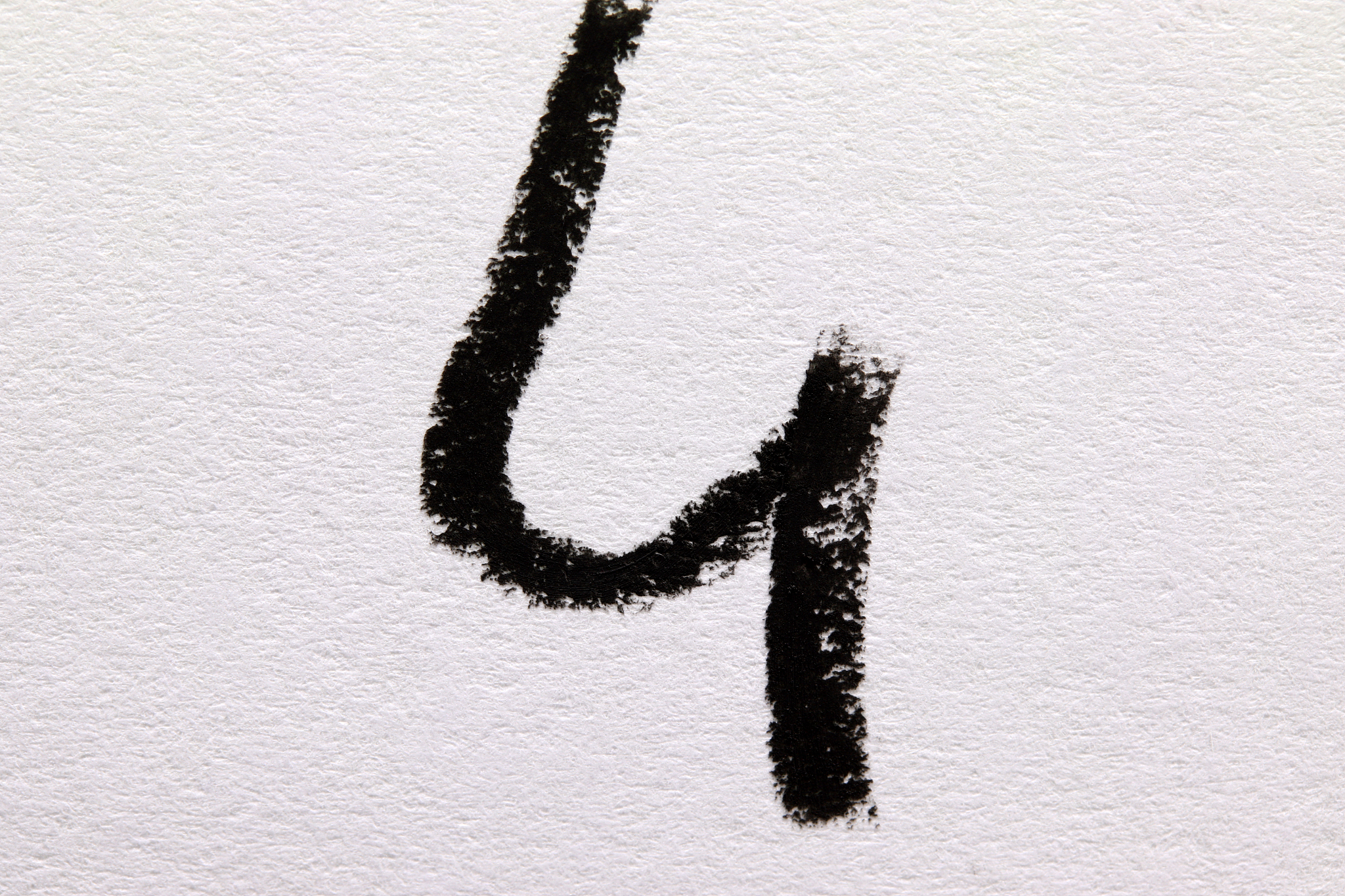 number four made of black and white crayon