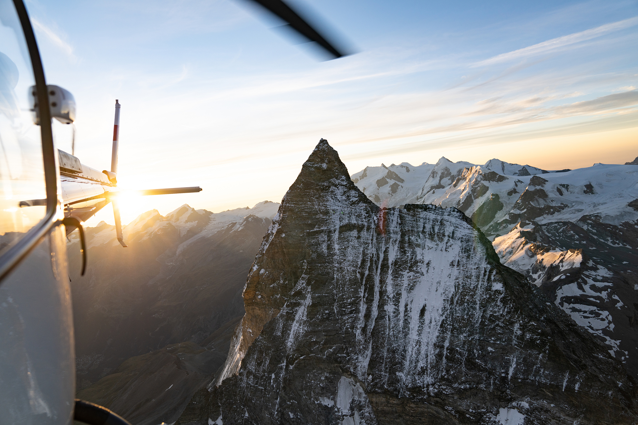 aerial flying around the top of the matterhorn in switzerland wi