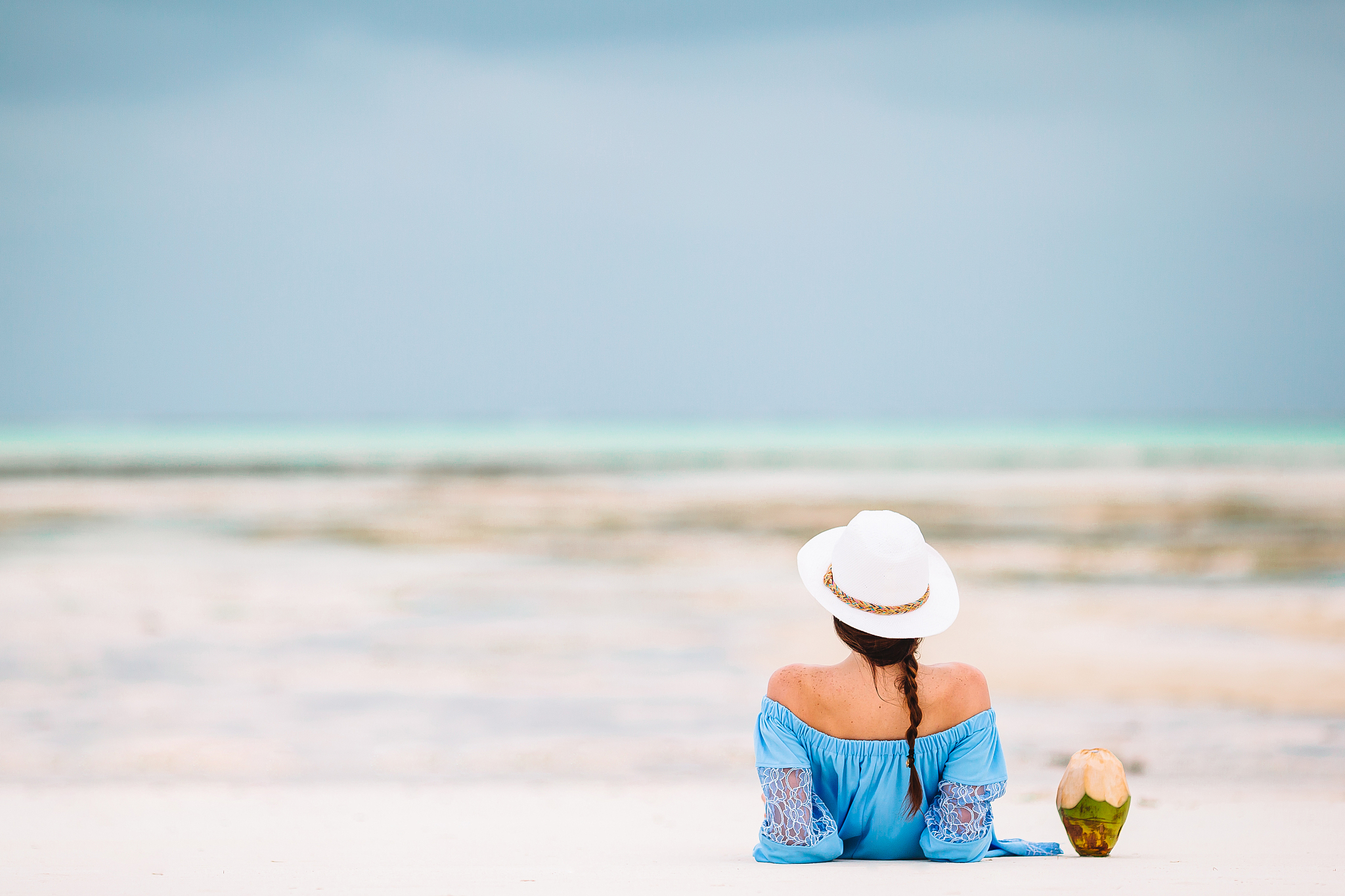 young beautiful woman having fun on tropical seashore.