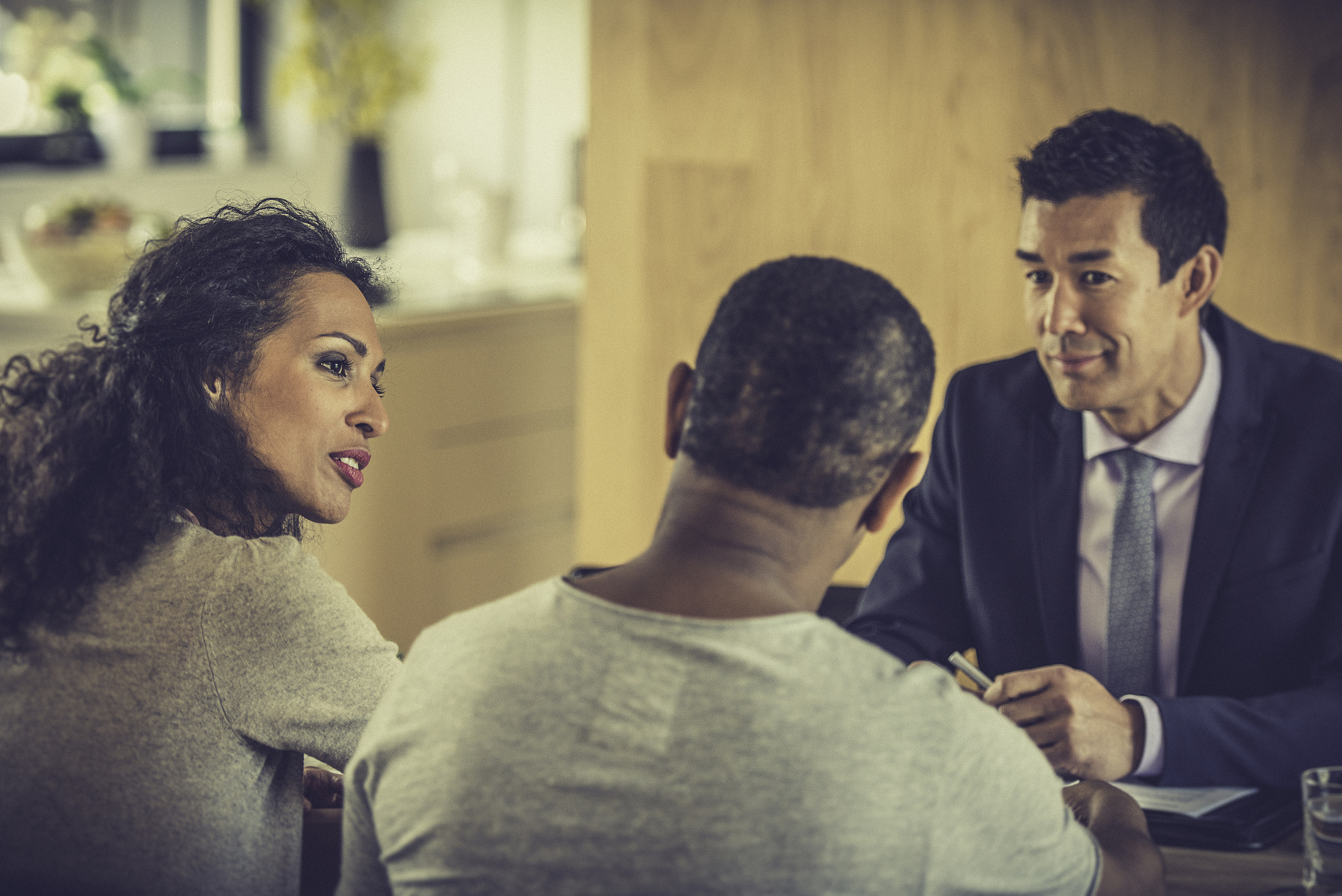 couple of african descent consulting their insurance agent