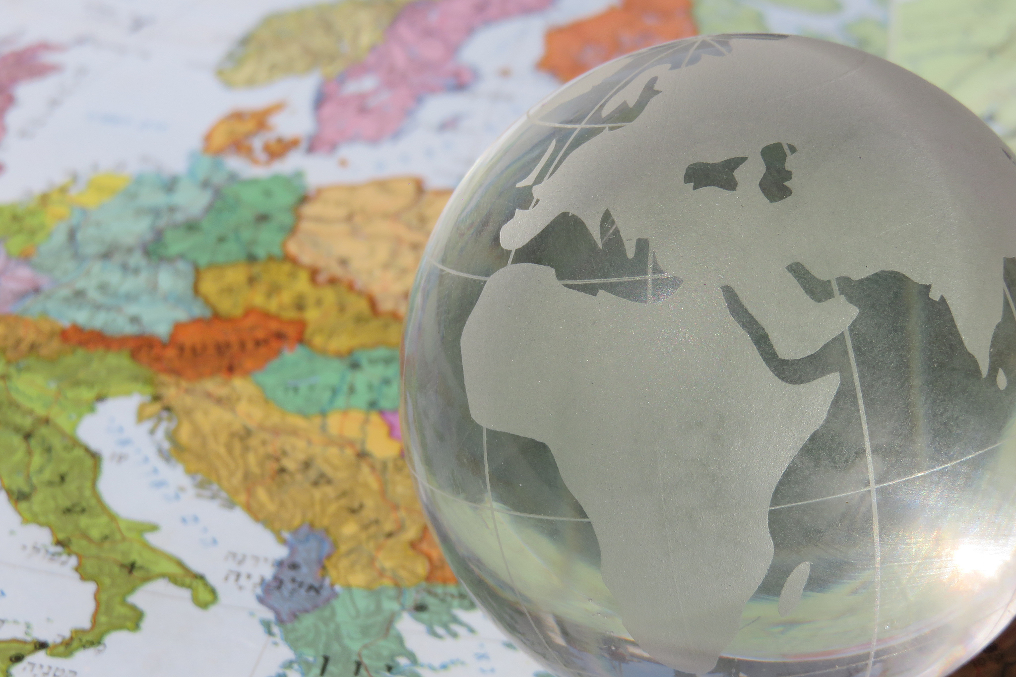 crystal globe on top of old tin globe