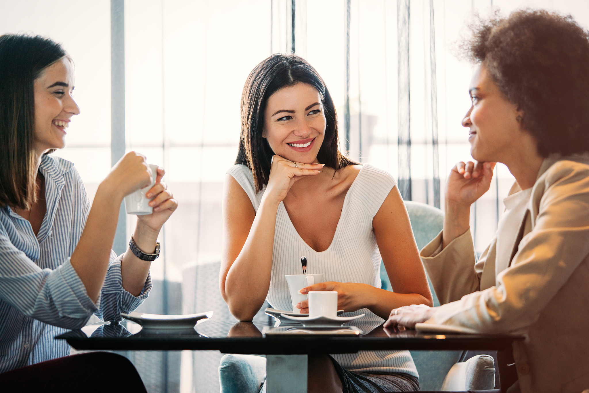 group of people enjoyed talking and drinking coffee together in 