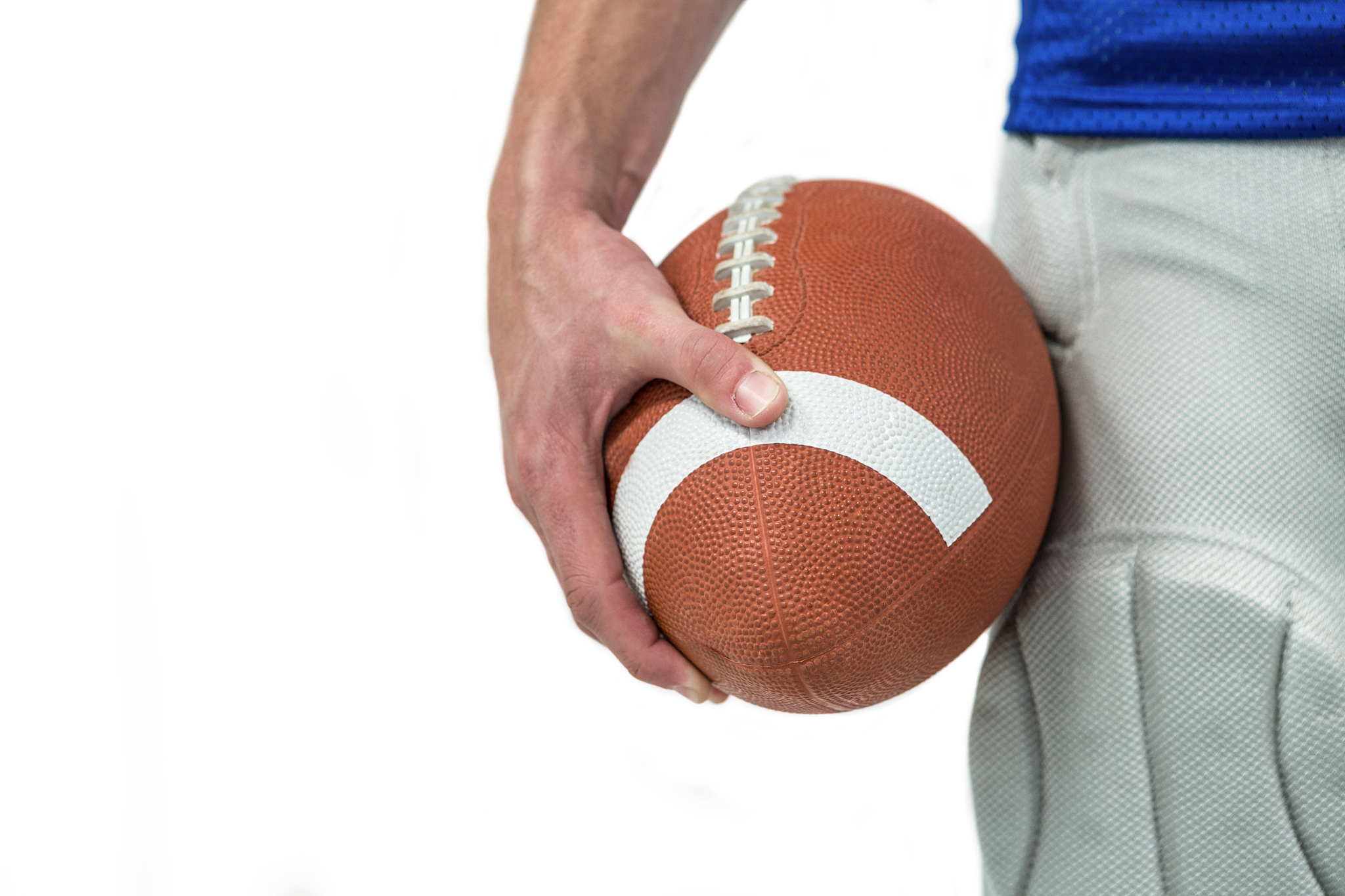 close-up of sports player holding ball on white background