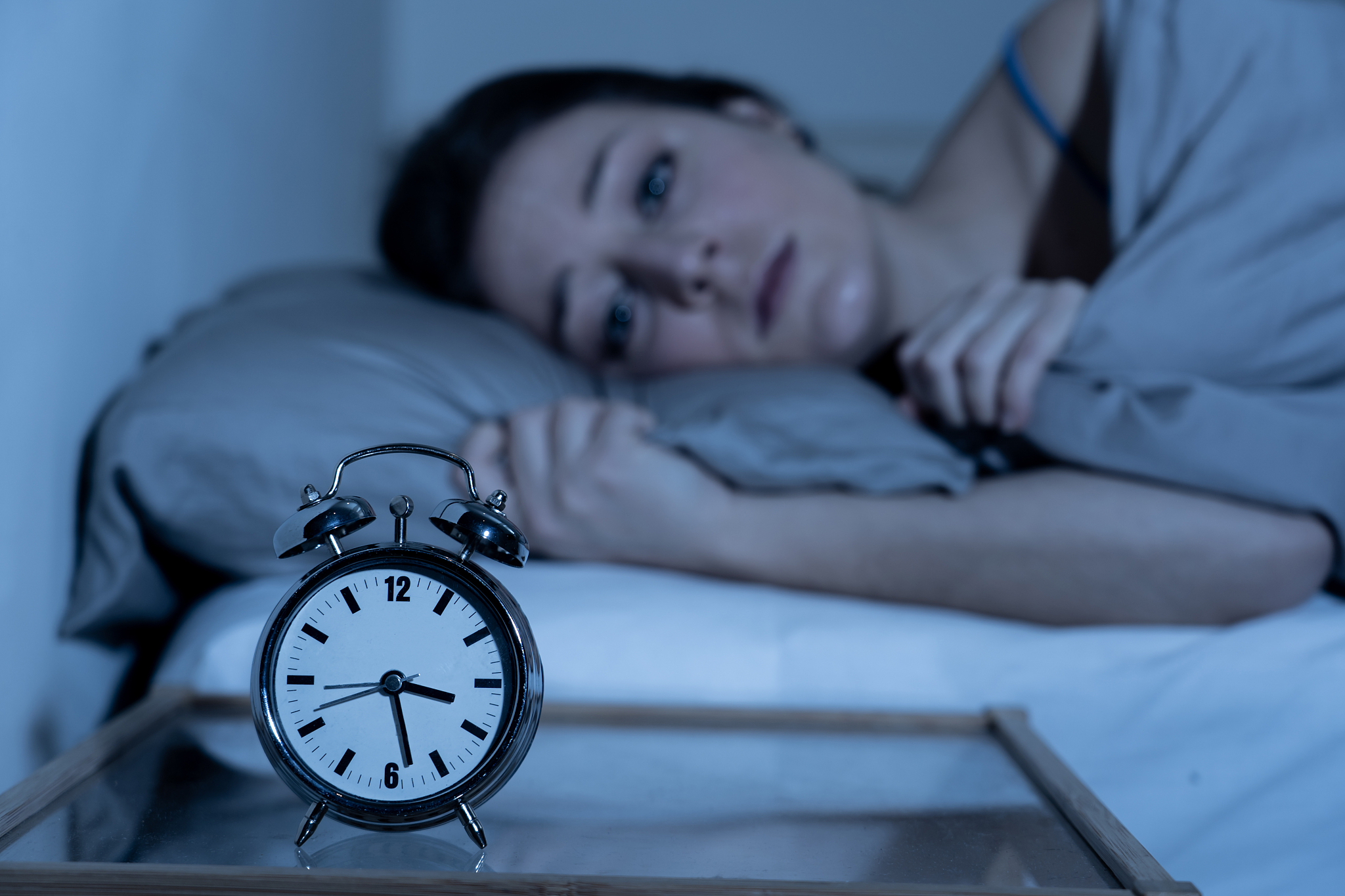 sleepless and desperate beautiful caucasian woman awake at night