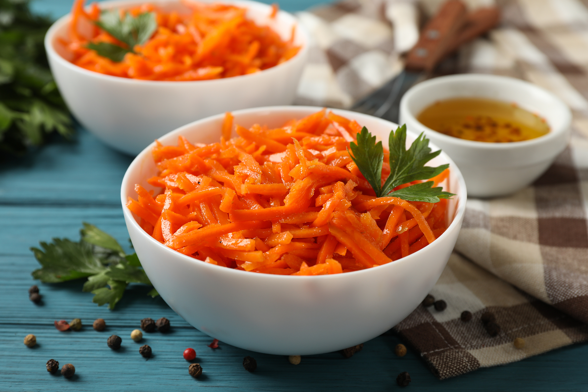 composition with tasty carrot salad on wooden background. korean