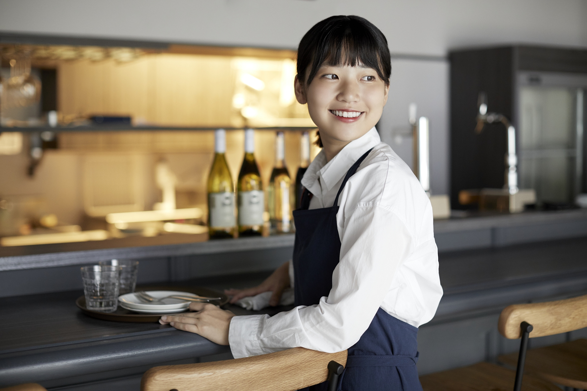 young japanese woman working at a restaurant
