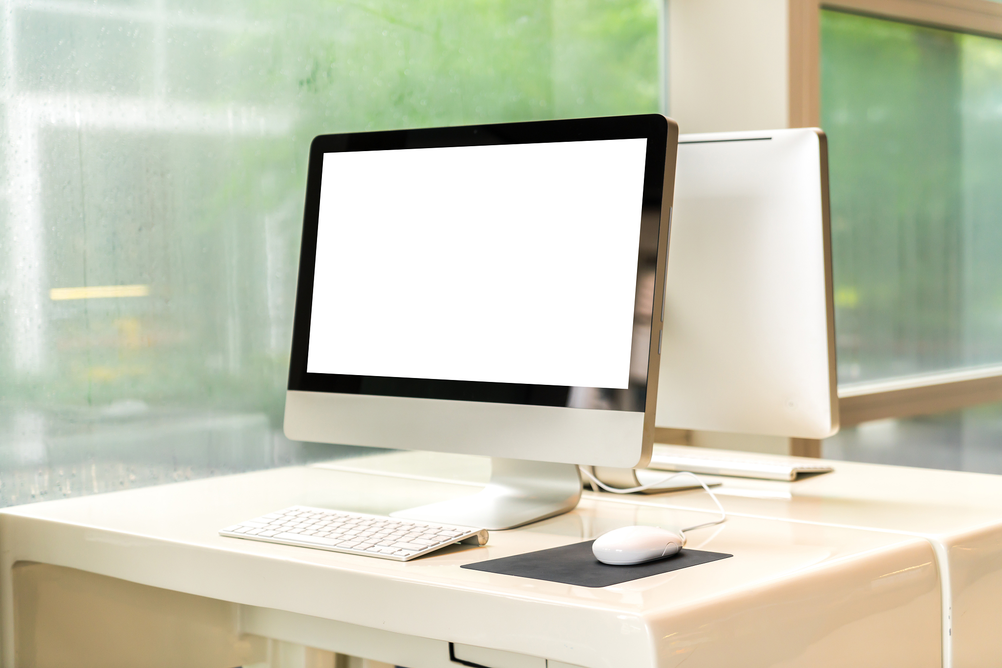 computer on a table in an office