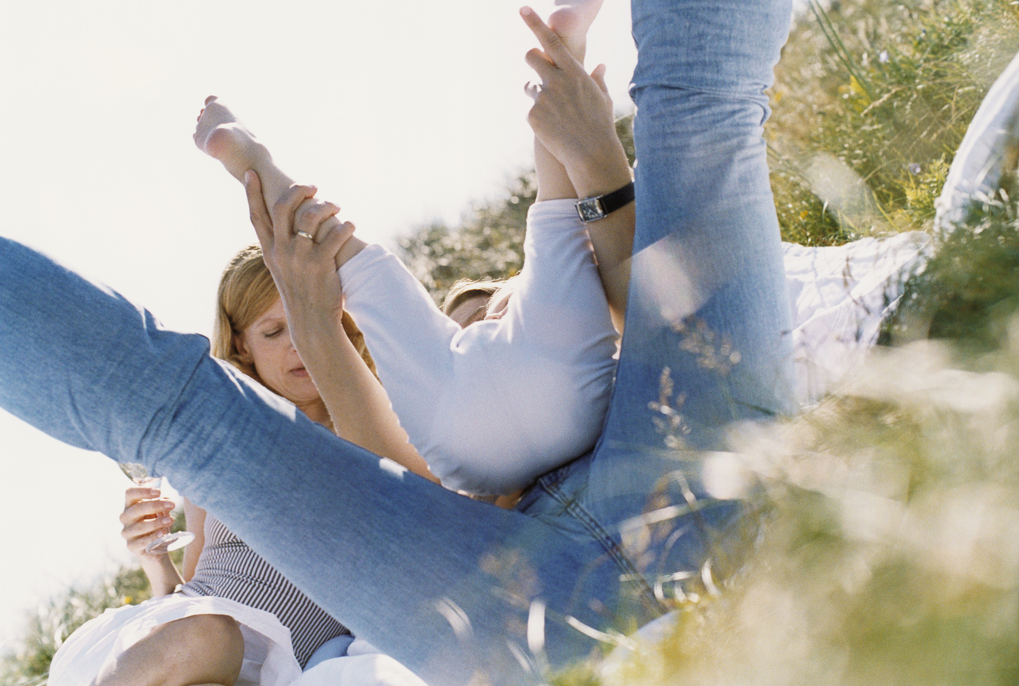 women playing with girl outside