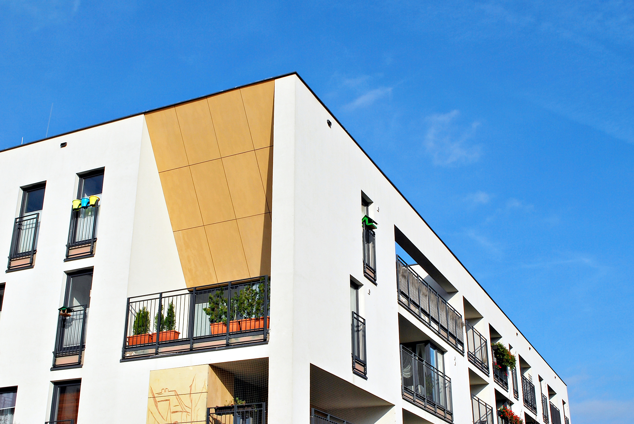 modern apartment buildings on a sunny day with a blue sky