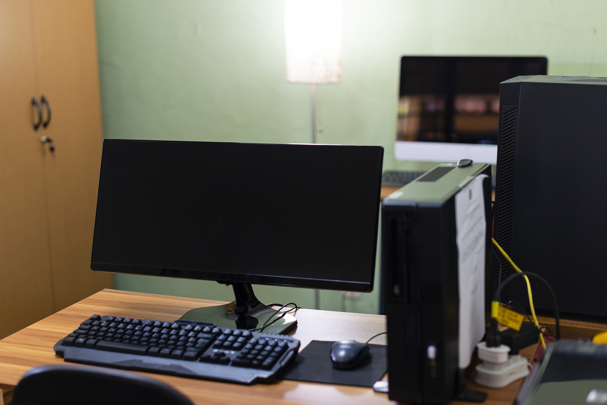 home office with several computers. stay at home
